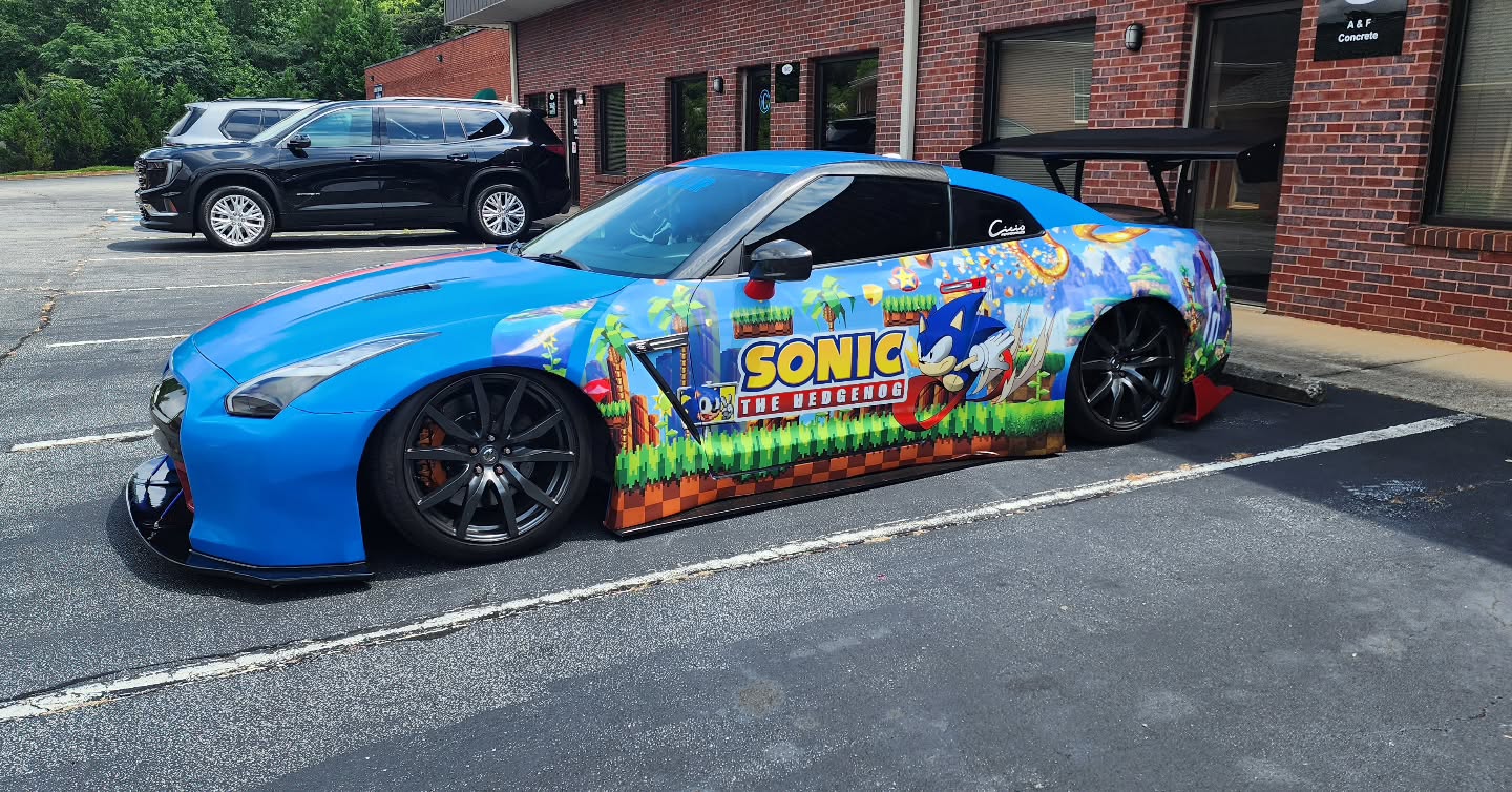 Transforming a Nissan GTR into a Sonic themed itasha build was an exciting project that combined high performance automotive styling eith vibrant anime and gaming inspired artwork.
The wrap featured Sonic in dynamic action poses with bold blue tones, speed effects, checkered graphics, and custom sponsor style accents that matched the aggressive body lines of the GTR.
Every panel was carefully aligned and installed to keep the artwork flowing seamlessly across the vehicle. The process took several days between printing, laminating, prep work, and installation, but the final result gave the GTR a fast energetic look that immediately grabs attention both on the streets and at car events.
.
.
.
#sonic #itasha #gaming #gtr #r35 #bagged #widebody #airliftperformance #airlift #coupe #nissan #anime