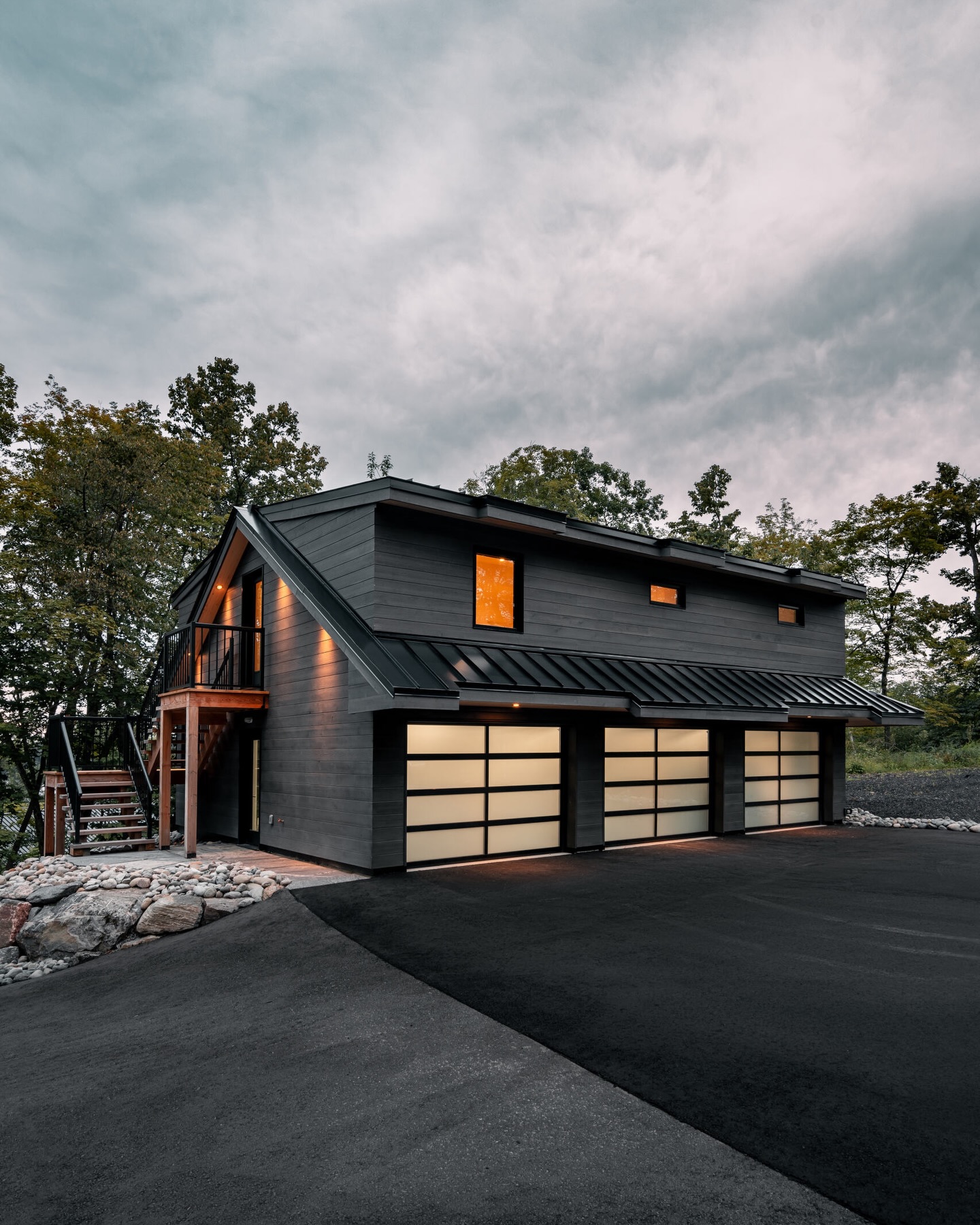This custom garage doubles as a guest suite and workshop, all in one smart space.
#custombuild #muskokalife #outdoorliving
With more than 2,000 square feet, this custom garage blends practicality with style. A heated three-door garage and workshop anchor the main level, while the upper floor offers two bedrooms, a generous living area, and a modern kitchen and dining space.
Follow @pattymacbuilt for more home & cottage inspiration!
Follow @spencerdouglasmuskoka for more design content and inspiration.
Built by @pattymacbuilt
Design by @spencerdouglasmuskoka
.
.
.
The team involved:
Plumbing: @leeplumbingmuskoka
HVAC: @gravenhurstplumbing
Bathroom Floor & Shower: @m2tilestone
Interior Finishing, Painting Material: @muskokalumber
Exterior Stairs: @muskokatimbermills
Interior Framing Material: @weismillertimbermart
Mulch, Sand, Fill: @brentquarries
Siding/Soffit Install: @chidgeycontractingltd
Foundation: @eruditeconstruction
Garage Doors: @Muskokagaragedoors