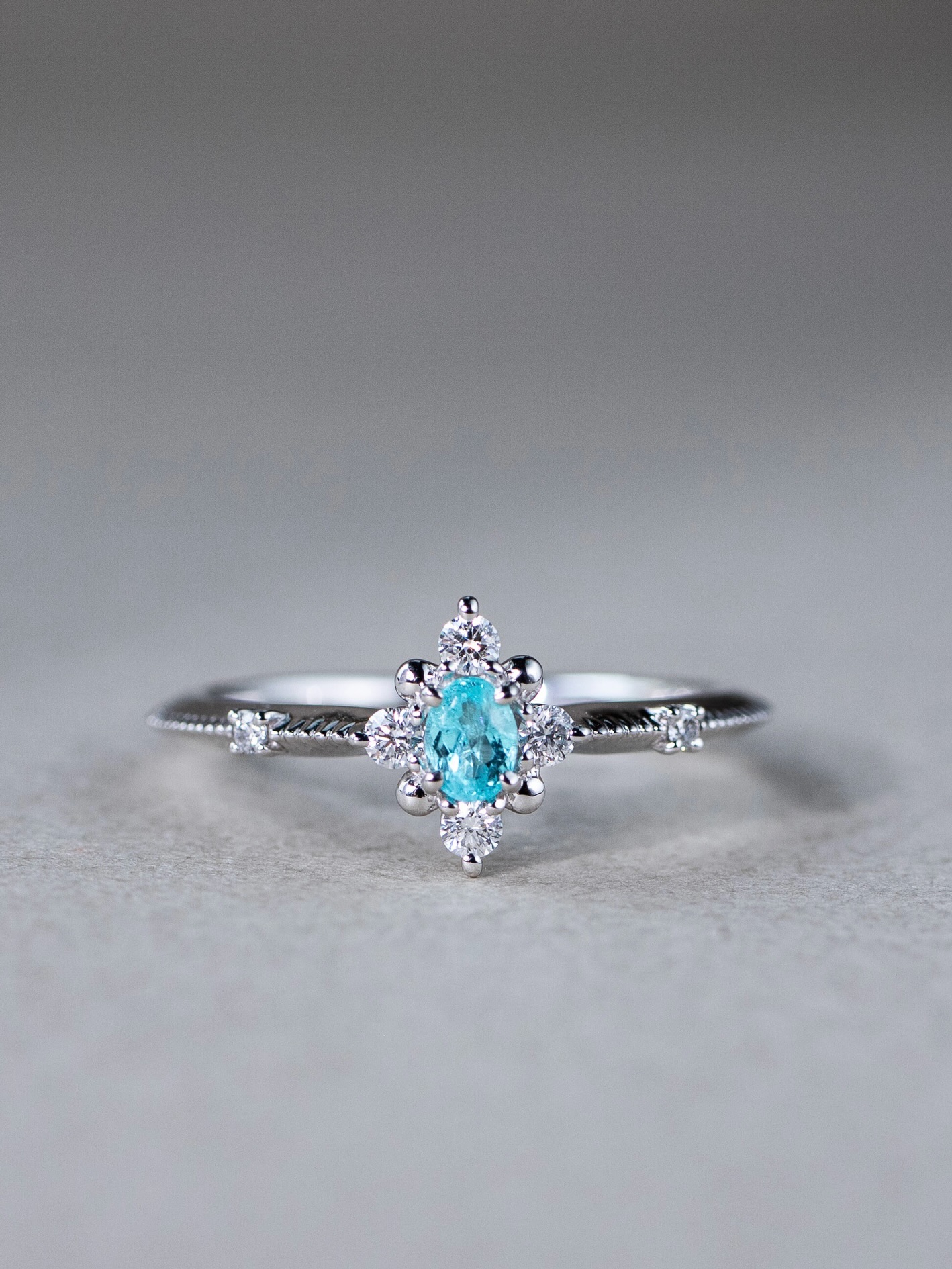 New In — Nieve Paraiba Tourmaline Ring
Charming with a vintage soul, the Nieve Ring features a 0.16 ct Paraiba Tourmaline, its vivid glow framed by four delicate diamonds that echo the elegance of a bygone era.
Intricate milgrain detailing along the band lends a soft, heirloom-like character, balancing brilliance with refined craftsmanship. A graceful piece for those drawn to vintage-inspired design, with a rare touch of colour that feels both timeless and distinctive.
Discover the collection at FUJIMORI KAJITA Ann Siang Hill Boutique today