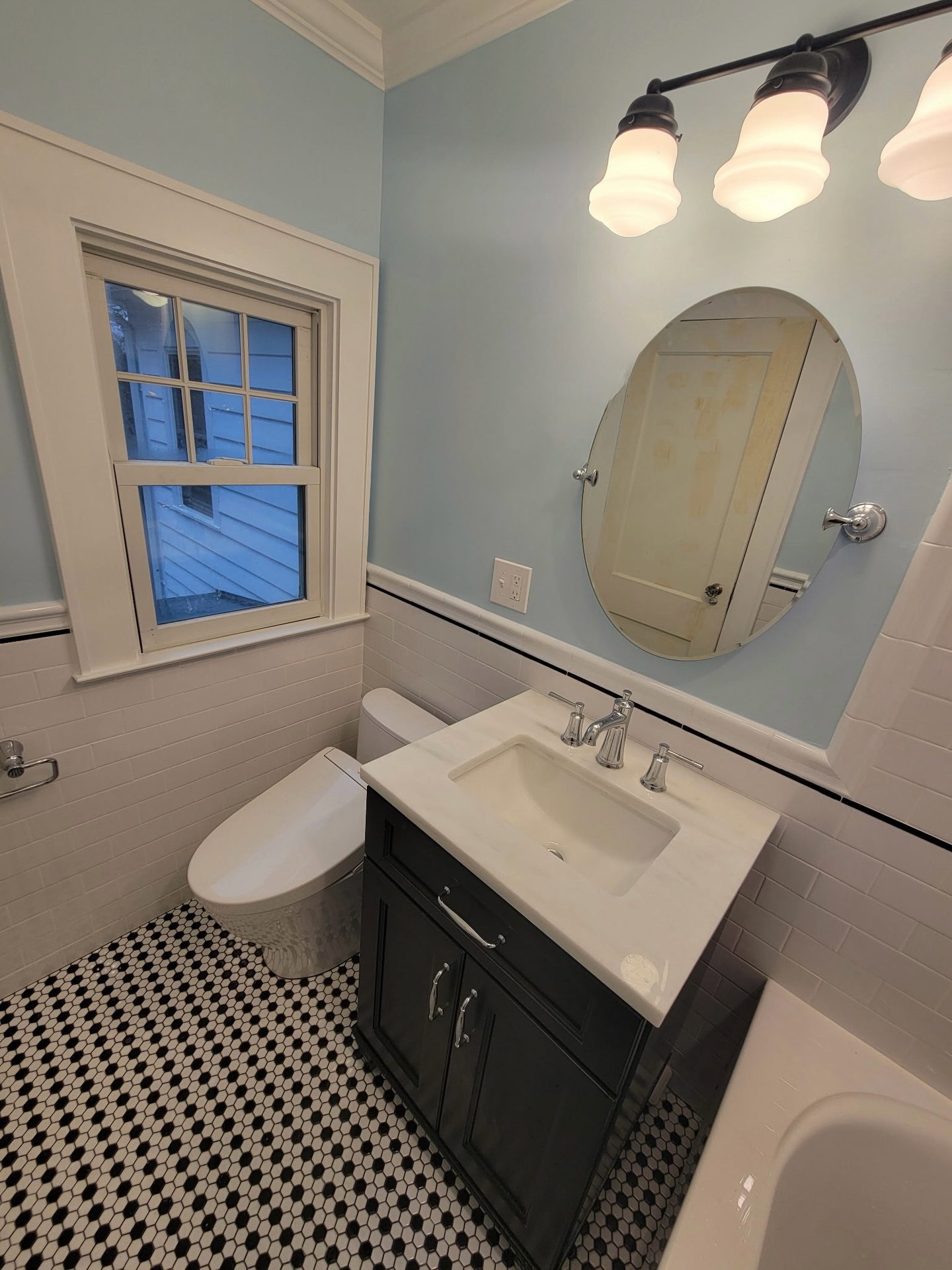 This 100 year old home got a stunning facelift, blending vintage character with modern indulgences like a therapeutic tub. Black and white tones were perfectly offset by chrome hardware, but the real showstopper is the bold blue walls. Give us a tough project and we’re in our element! 203-778-9385
#bathroomdesignideas #bathroominspiration #bathroomrenovation #designbuildcontractor #homeimprovementprojects