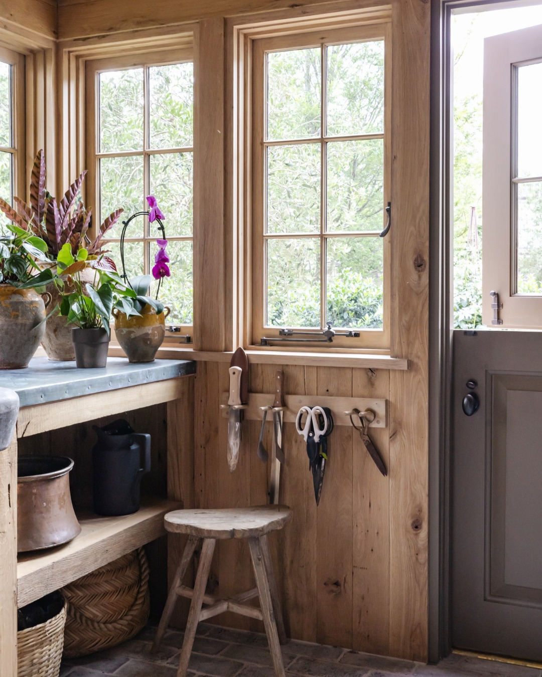 Outdoor storage has a way of becoming a catchall, but the same principles we apply inside the home matter just as much outside.
- Start by removing everything, assess what truly serves a purpose, and reintroduce only what earns its place.
- Group like items together, use clear bins when possible, and keep the most frequently used tools within easy reach.
A shed should support your lifestyle, not store forgotten clutter. With a little intention, even the most overlooked spaces can feel organized and efficient!