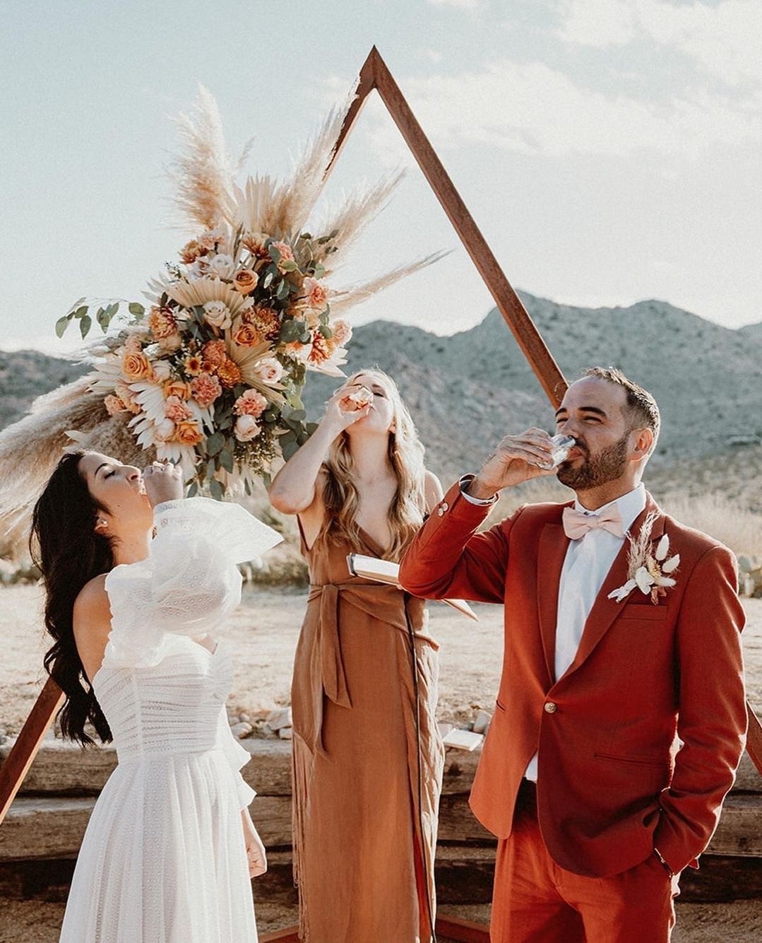 C’est la vie 2023! Happy New Year from all of us at Sacred Sands! Ceremony shots from Emily + Patrick’s beautifully designed, November wedding. Cheers to 2024 and manifesting all your dreams and more! Sante!
🥂 💫 🌵
•
•
•
Bride+Groom: @emilyzendel + @patburke___
Photographer: @jennandpawel
Venue: @sacredsandsjoshuatree
Florals: @desertrose.creative
Hair/Makeup: @deserthoneyartistry
Rentals: @sigpartyrentals
DJ: @lunakye
Officiant: @carlykreiaopolinario
Catering: @tasetenomada
Dessert: @sandiablochurros + Nectarine Grove Cinnamon Rolls
#SacredSands #SacredSandsJoshuaTree #JoshuaTree #JoshuaTreeCalifornia #DesertVibes #DesertLife #joshuatreewedding #bohodecor #joshuatreebride #joshuatreehotel #joshuatreeairbnb #weddingdetails #desertwedding #joshuatreevibes #joshuatreestyle #bohowedding #bohemianwedding #rusticwedding #weddingphotos #weddingday #weddingwire #theknot #destinationwedding #weddingreception #weddingstyle #intimatewedding #instawedding #weddinginspiration
#weddinginspo #socalwedding