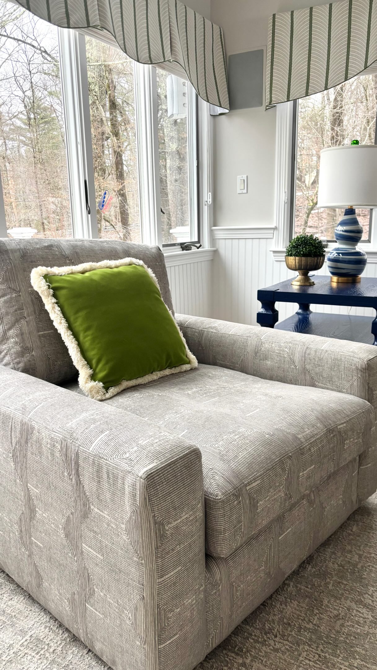Introducing our latest project ✨a room that was designed for cozy living. We started with the softest cut to fit area rug and brightened the room with a fresh coat of paint. Our clients wanted lots of seating for their family enter a custom sofa with extra deep seating. We added fun splashes of color by painting side tables in a high gloss blue, coordinating custom pillows and the prettiest scalloped window valances. We just love this everything about this family room. #homedesigner #homestylinginspo #homestylingideas #interiorhomedesign #familyroom