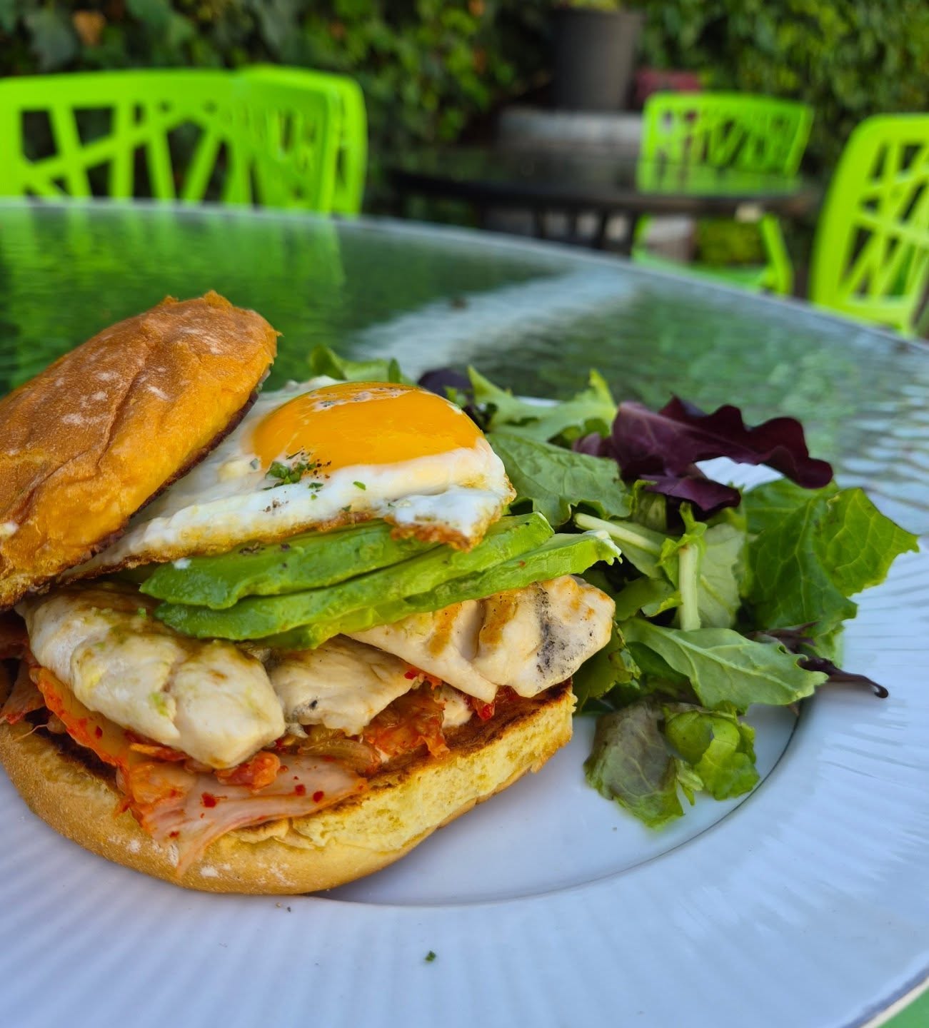 Grilled chicken Sandwich Special!! Grilled @maryschicken, jalapeño mayo, avocado, kimchi and a fried egg, all served with a simple salad!