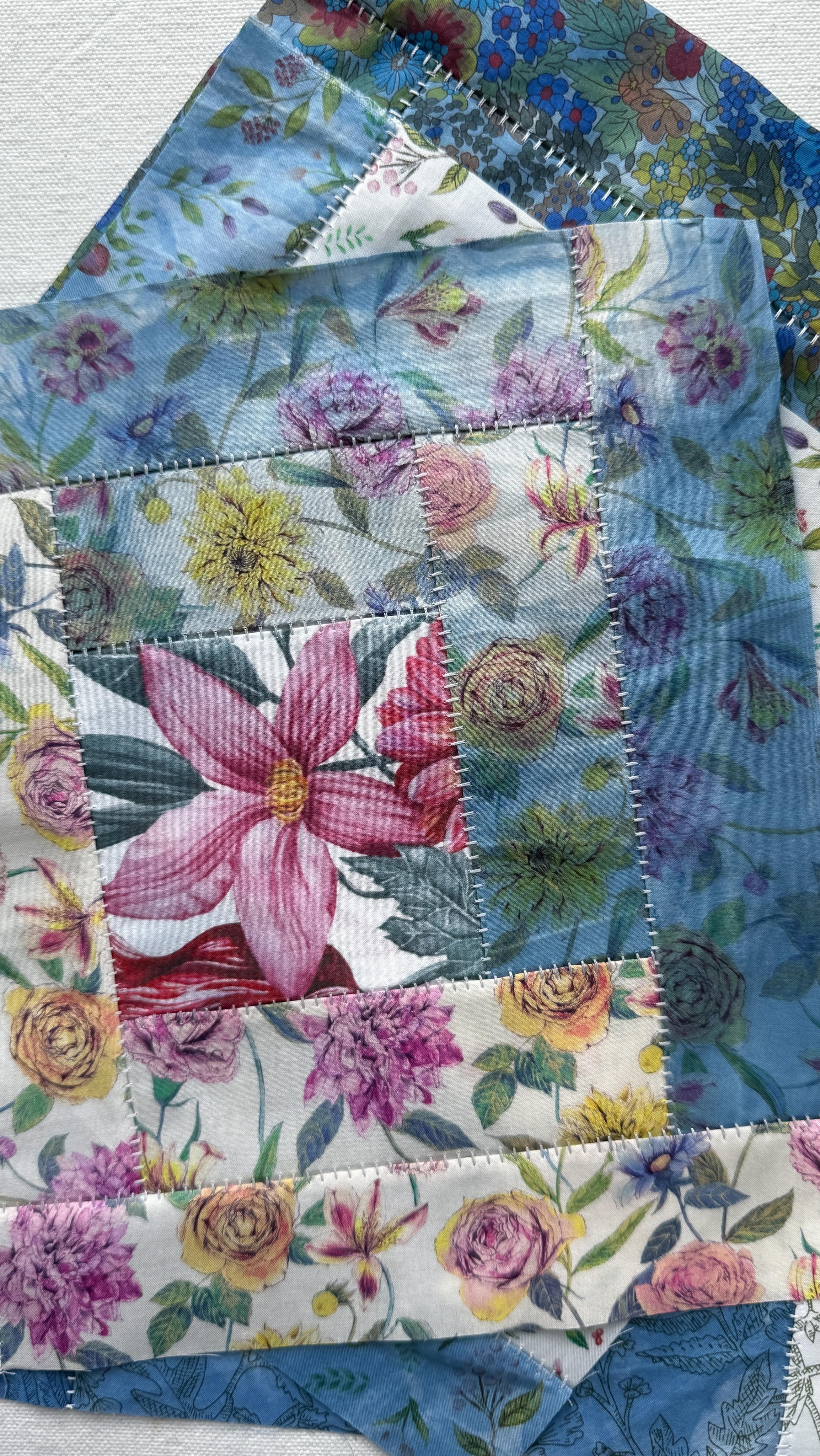 Remember when I explained how my projects are tea leaves and they get put away for a bit when they need to steep in my brain water? It’s ok if you missed that revelation into the inner workings of my mind, it was quite silly.
I’m just bringing it up because these log cabin blocks that I made with @libertyfabrics Tana Lawn that I partially hand-dyed in an indigo vat, well they have required extra steeping. Because the fabric is so special.
I keep changing my mind on what I want to do with them, and if u want to use up the rest of the fabric to make more blocks. But I’ve finally decided: I’m going to make just a couple more to make a small wall/art quilt, and save the rest of the fabric for a future item of clothing.
The process to make these is different than usual because I use a flatlock stitch on my @berninausa L890 Overlock/Coverstitch rather than sewing them on my sewing machine. That’s why they look like they have little thread ladders!
I’m hoping to get the rest sewn this week… if Penny lets me.