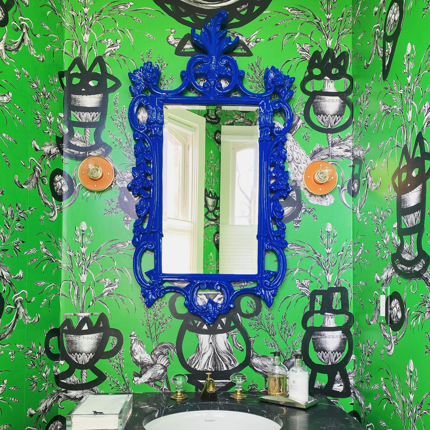 This tiny jewel box of a bathroom is ready just in time for spring. When the client asked for something “bold” and “different” I immediately thought of @lamaisonpierrefrey.
This wallpaper’s neoclassical print is made contemporary with graffiti style drawings superimposed overtop. The vibrant green, blue and orange create a dynamic color scheme that’s as much whimsical as it is sophisticated. Black and white accents ground the space.
Such a fun project to work on and great clients who trusted the process.
.
.
.
.
.
.
.
.
#cpi #interiordesign #inspiration #cpifavorite #new #dcdesign #livingbeautifully #wellappointedhome #gooddesign #art #design #ilovemyjob #interiors #designingspaces #timelessdesign #interiordesigner #designer #luxuryinteriordesign #thebeautyofhome #beautifulspaces #homebeautiful #designtrends #remodel #bathroom #powderoom #green #spring
