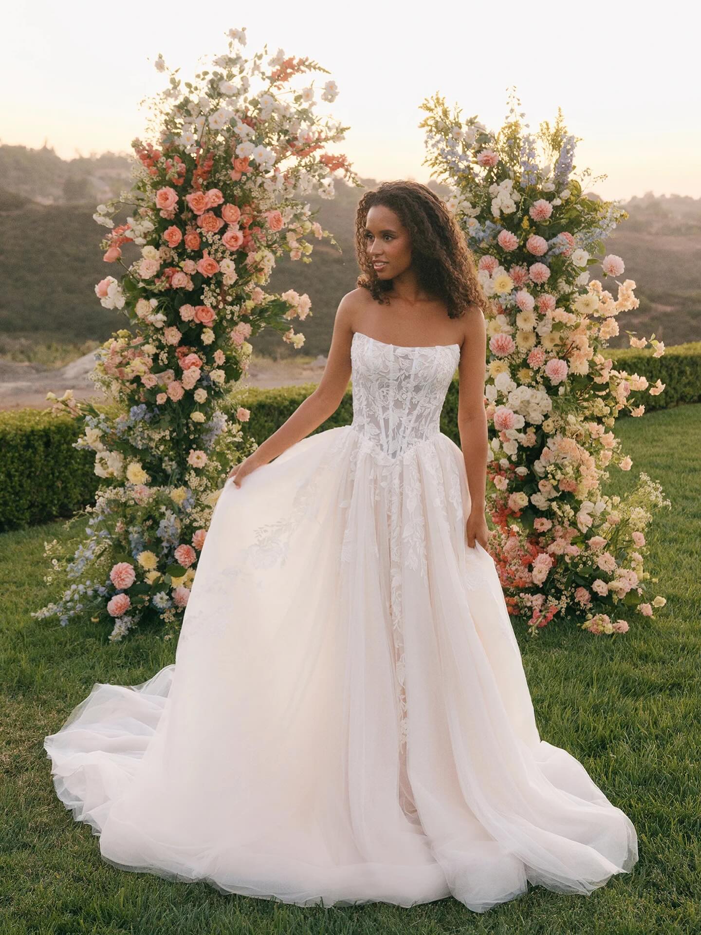 Our most recent @allurebridals arrival!🤍🫶🏼 Shimmering sequin lace appliques cascade over layers of soft tulle in this romantic ballgown. The strapless subtle cat-eye neckline frames an exposed-boning, corseted bodice that sculpts and defines the basque waist before flowing into a full, airy skirt. 🤍