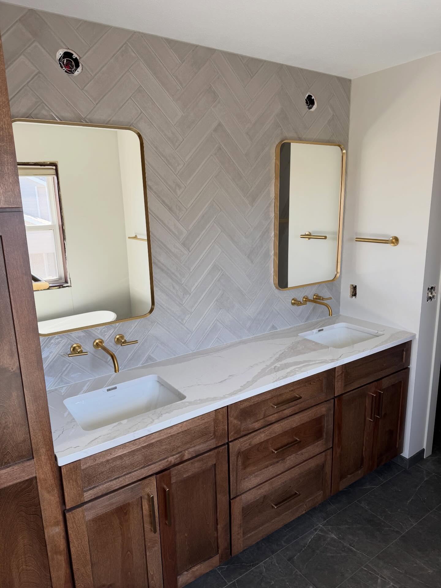 We love a @cambriasurfaces install day! Countertops start to make a project feel complete, and give our customers a glimpse at the finish line. What could be better than a beautiful solid surface American made quartz for this gorgeous double vanity??