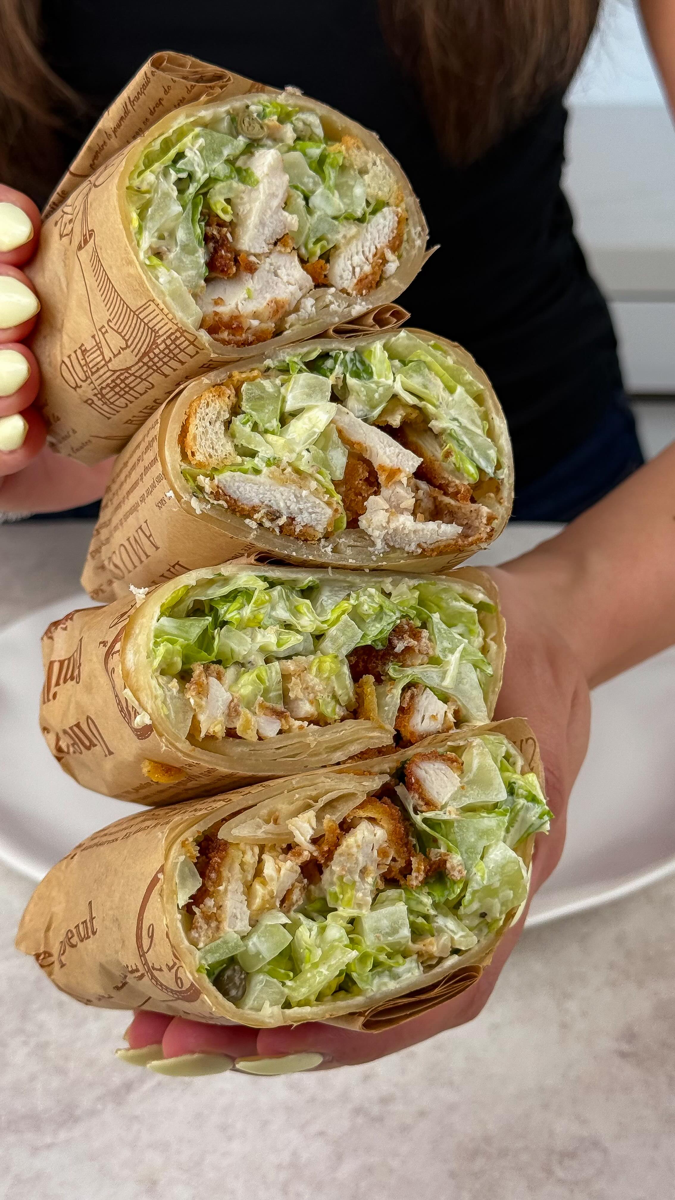 Crispy Chicken Caesar Wrap 🌯
This is what I wish every chicken caesar wrap tasted like.
Crispy chicken, creamy caesar, parmesan crisps, capers, all in a warm, yummy tortilla 😮💨
so simple, so saucy, and way better than anything I was ordering
would you try this? 😏 save this one
makes 4 wraps
crispy chicken 🍗
2 chicken breasts, sliced in half lengthwise and pounded thin into 4 cutlets
3 eggs
1 cup flour
½ cup breadcrumbs + ½ cup panko
season everything well with salt + pepper + garlic powder + paprika
coat flour → egg → breadcrumbs
rest 15 to 20 minutes, then shallow fry 4 to 6 minutes per side until golden
rest and chop
easy eggless caesar 🍋
½ cup mayo
¼ cup sour cream
juice of ½ to 1 lemon
¾ cup parmesan
2 garlic cloves
2 tsp worcestershire
salt and pepper
caesar filling 🥗
3 cups romaine
½ cup parmesan
¾ cup caesar dressing
black pepper, capers, parmesan crisps
toss until super creamy and coated
assemble 🌯
4 tortillas, warmed
add filling + chicken
roll tight, slice
serve with extra dressing for dipping 😮💨
#caesarwrap #crispychicken #homemade #highproteinmeals #healthyrecipes