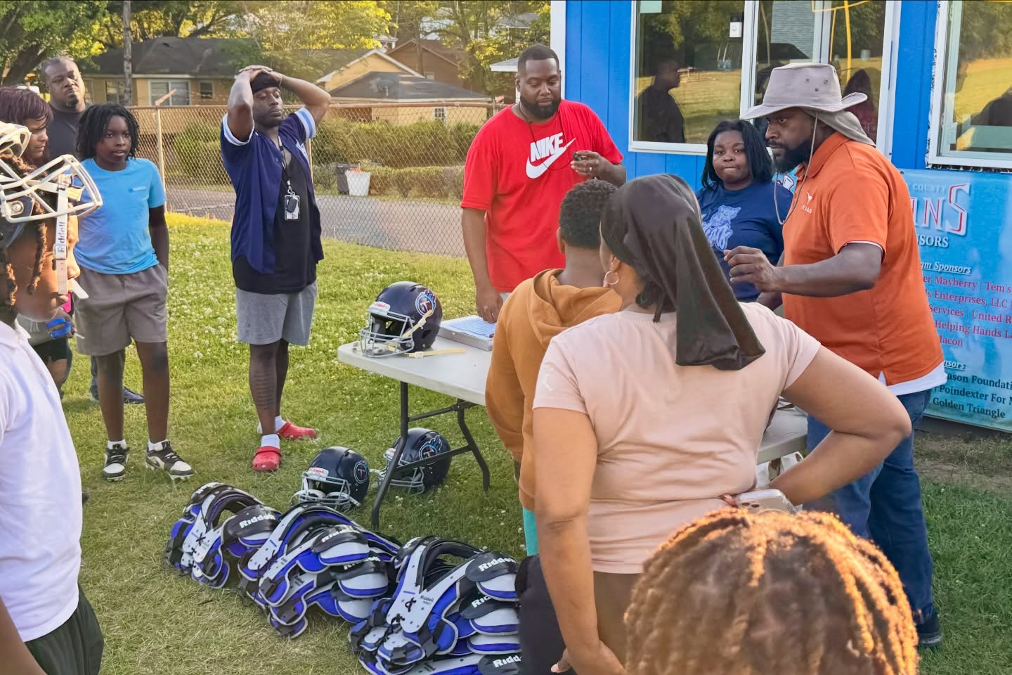 12U is getting prepped with equipment. Parents came in to help, and players even arrived on bikes. Gotta love the Titans. #TitanUp #share