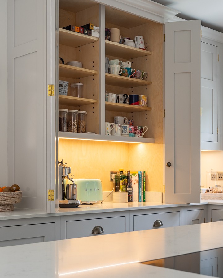 Integrated lighting inside the breakfast cabinet improves visibility for everyday use, while giving the kitchen a softer and more inviting feel. #BespokeDesign #KitchenInspo #InteriorDesign #ModernLiving