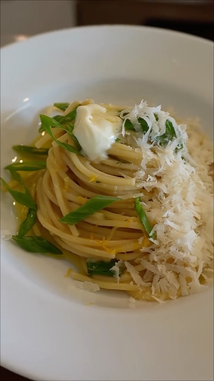 Sometimes inspiration arrives not in the kitchen… but in the glass. This isn’t just a drink, it’s a direction. A reminder to relax, slow down, and be present with yourself. 🍋🍸
Full recipe below and in my Substack at lenorenolanryan
@drinkdryanddirty Lemon Drop Elixir recipe:
3 oz Dry & Dirty Lemon Drop Martini
½ oz fresh lemon juice
2–3 slices fresh ginger
Sprig of rosemary
Ice
Lemon zest peel
Light drizzle of lemon olive oil
@graceeradesign Zelda Martini glass
One-Pan Lemon Drop Pasta:
12 oz linguine or spaghetti
6 tablespoons olive oil
4 cloves garlic, thinly sliced
1 shallot, and 1 knob ginger, finely minced
2–3 green onions, sliced (white and green parts separated)
Zest of 1 lemon
1 Dry & Dirty Lemon Drop Martini Ginger Cocktail (zero-proof)
4 cups Rosemary Lemon @brodo
Juice of 1 lemon
4 tablespoons each butter and creme fraiche
Fresh herbs (parsley and basil)
Salt and freshly cracked black pepper
Parmesan Reggiano (thank you @winewatch for mine!)
In a large pan, heat the olive oil over medium heat, then add the pasta, ginger, garlic, shallots, and green onion. cooking gently until fragrant. Add lemon zest and allow it to bloom.
Pour in the Lemon Drop Martini and let it simmer briefly. Add stock and bring to a boil. Add pasta directly to the pan, cooking and stirring until tender and silky. Add in the Brodo and cook covered until it comes to the boil, then uncover to continue cooking. When the pasta is nearly done, add the Dry and Dirty Elixir Cocktail and creme fraiche, then swirl it around until incorporated. Finish with butter, lemon juice, and green onion tops. Season to taste with salt and pepper. Enjoy!
#lemonpasta #onepanmeal #lemondrop #martini #recipe