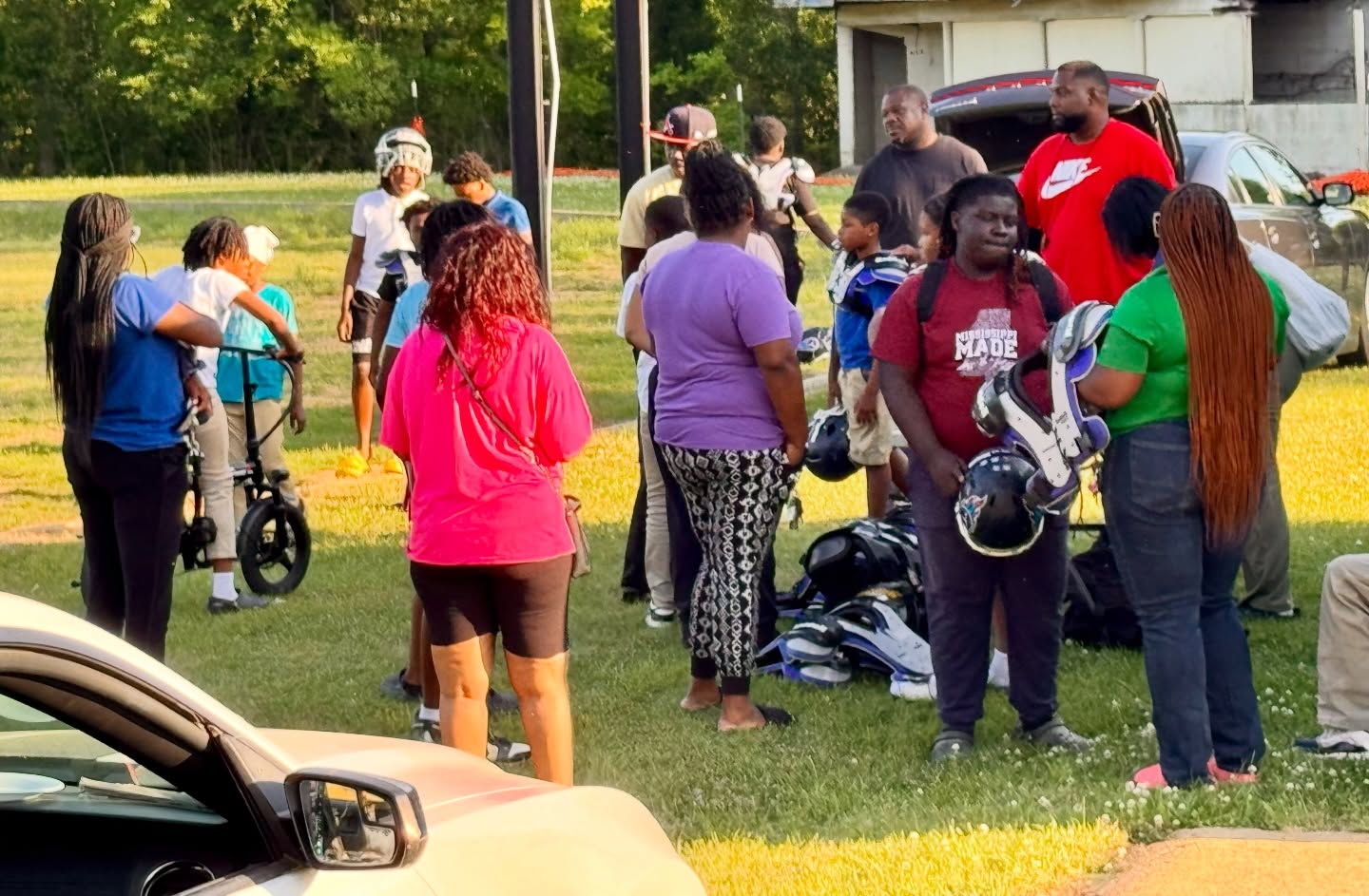 12U is getting prepped with equipment. Parents came in to help, and players even arrived on bikes. Gotta love the Titans. #TitanUp #share