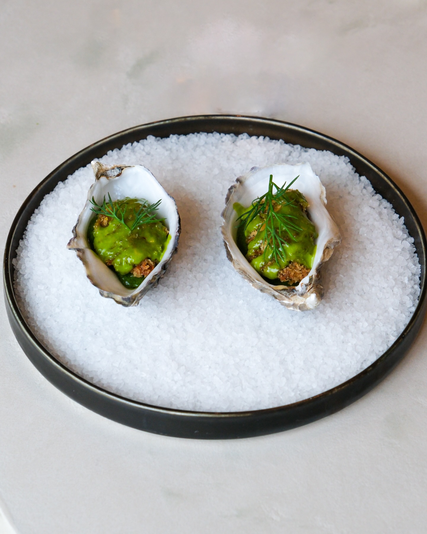 Fried oysters, served with dill emulsion and a bright pine “aguachile” - part of our small plates lunch menu, designed for sharing and best enjoyed together.