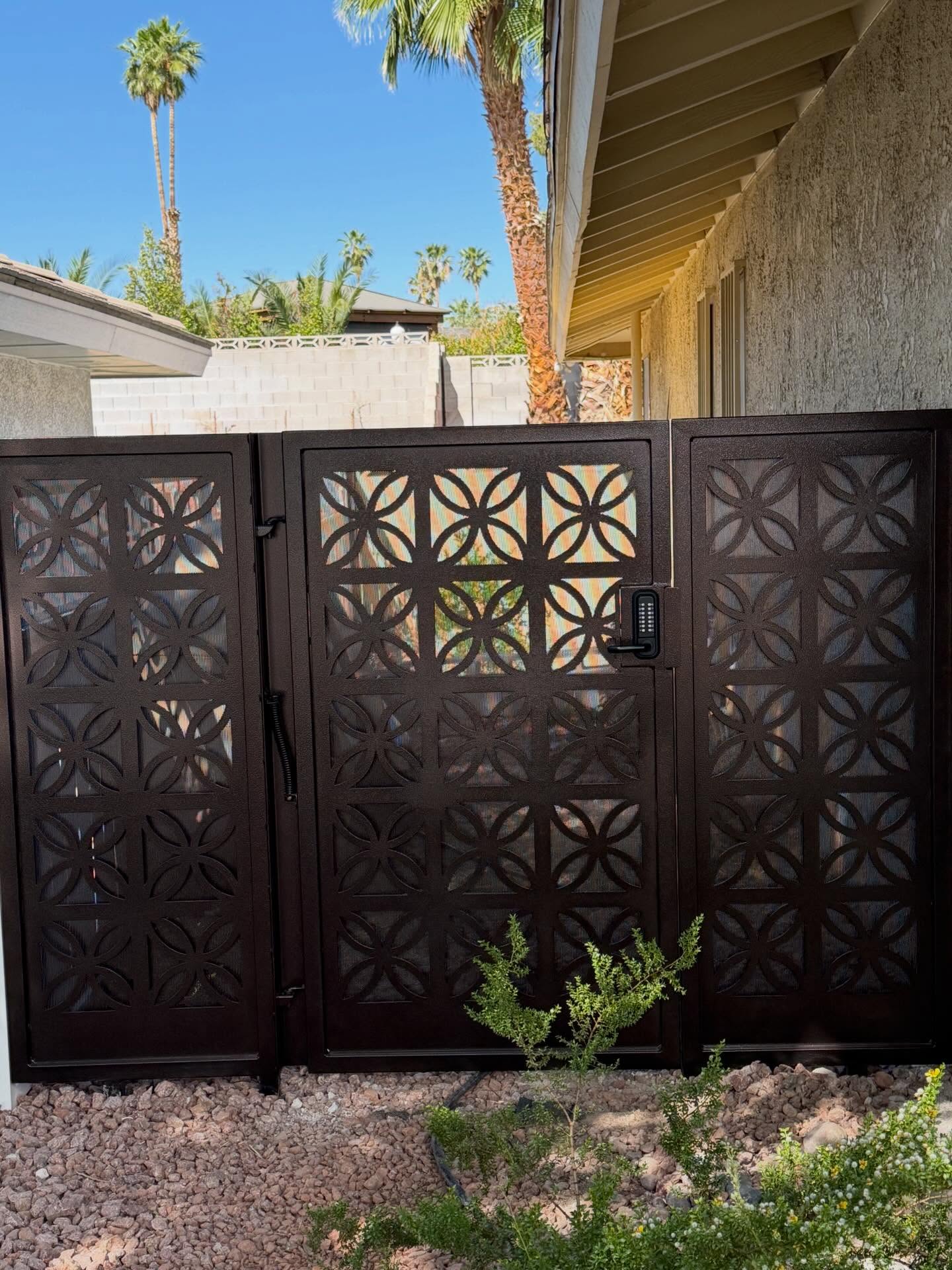 LaCosta gate with side panels finished in a textural Copper Vein powder coat. Pictured next to the neighbor's groovy screen. I love how these neighbors both express their style together.