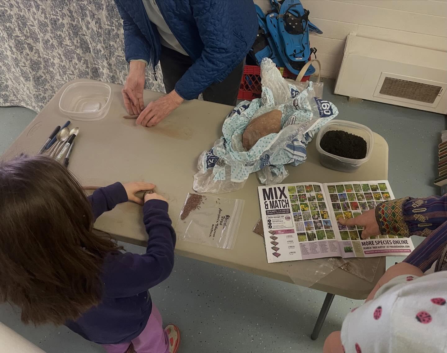 We had a fun day on Tuesday, with kids scouring the library for hidden golden eggs, making seed balls, special story time, free trees from neighborhood forest for Earth Day, and through all of it, someone sat in the comfy chair and happily read a book.