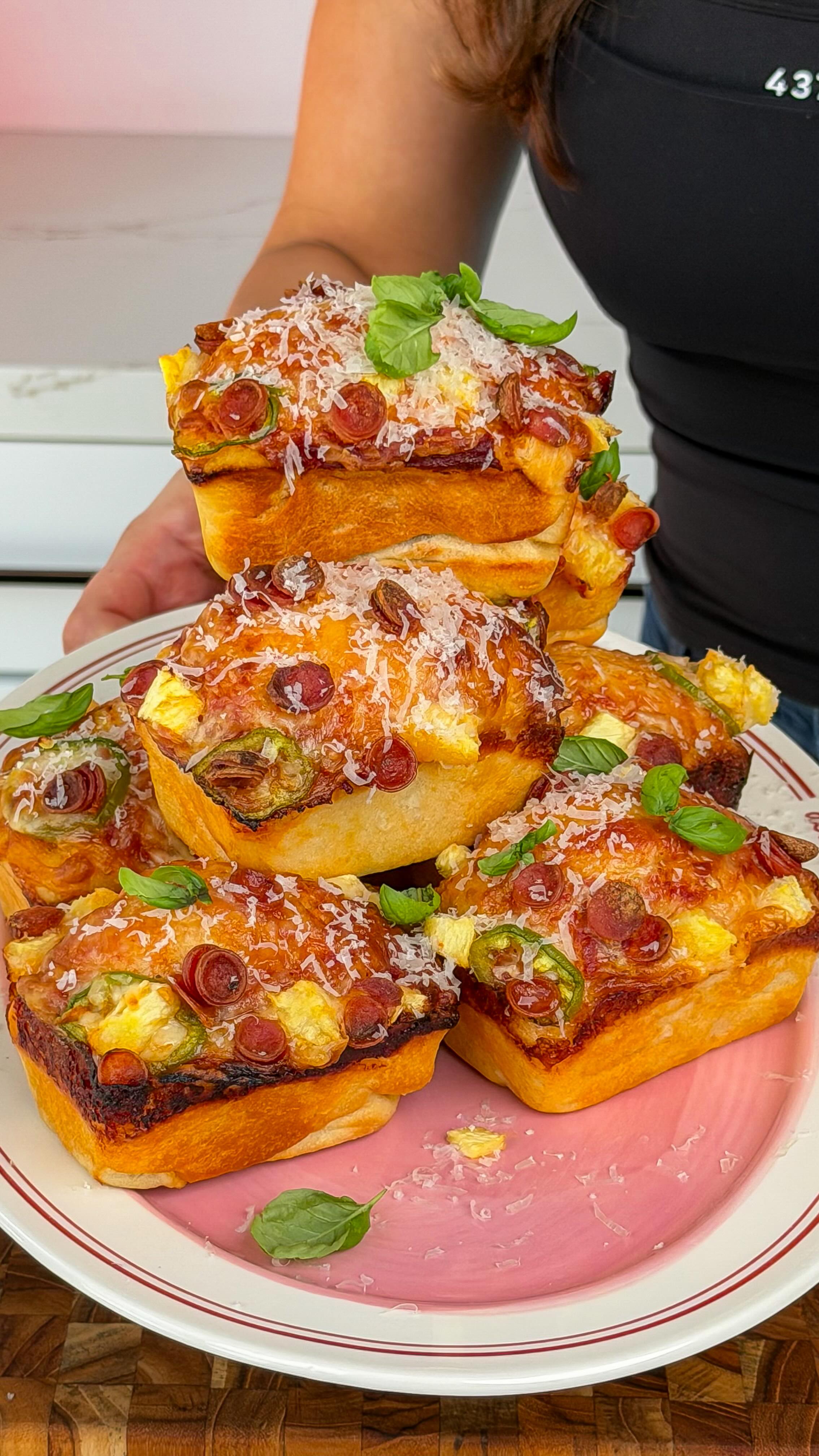 Mini Deep Dish Pizza Bites 🍍
Crispy golden edges, soft + cheesy centers, and that sweet + spicy combo with pineapple, jalapeño, and pepperoni?? I’m telling you… this one is insane.
They’re the cutest, most snackable form of pizza. Perfect for pizza night or when you want something fun without doing the most 🍕 so easy anyone can make it.
Ib: @seans_pizza
🍕 Ingredients
2 store-bought pizza dough (room temp)
Olive oil cooking spray
Pizza sauce or marinara 🍅
Shredded mozzarella 🧀
Pepperoni minis
Pineapple chunks 🍍
Jalapeño slices 🌶️
Fresh basil 🌿
Grated parmesan
HOW TO MAKE IT
1. Preheat oven to 425°F and let the dough sit at room temp for 20 minutes. Cut the doughs into 8–10 equal pieces (I recommend 8 for thicker, fluffier pizzas or 10 for a thinner, more snacky bite).
2. Grease a mini loaf pan (don’t skip, this is how you get those crispy edges). Spray the top or grease your hands, then press each piece of dough into the pan, covering the bottom.
3. Add a light layer of sauce, then load it up with mozzarella, pepperoni, pineapple, and jalapeños (don’t be shy—add plenty because it cooks down and you want every bite covered).
4. Bake for 16–20 minutes, until golden, bubbly, and crispy on the edges.
5. Remove from the pan and finish with fresh basil + grated parmesan.
Save this for your next pizza night… you’re gonna want these on repeat 🍕
#pizzalover #homemadepizza #pizza #easyrecipe #dinnerideas