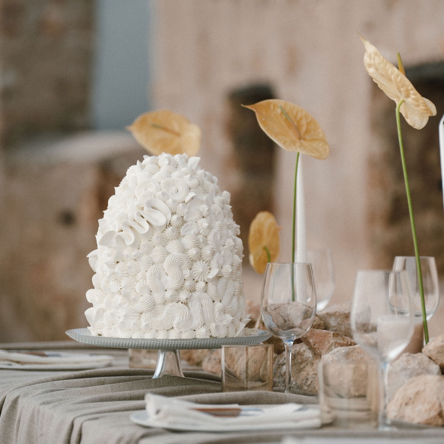 Timeless elegance meets the defining palette of 2026. 🕊️
I am still in awe of how @aboutsummeribiza curated this vision. By layering Cloud Dance White textures against raw, stony neutrals by @moods_ibz they’ve captured the “Earthy Luxury” trend perfectly, proving that modern design can feel both cutting-edge and completely timeless.
The subtle play between our piped cream textures and the wax-paper tones of the anthuriums by @flordelmundoibiza creates a sophisticated, organic harmony that feels incredibly fresh for this season.
Creative concept & planning @aboutsummeribiza
Photography @rawmaterialibiza
Videography @markbeijk_photography
Styling and decor @moods_ibz
Flower design @flordelmundoibiza
Wedding cake & tiramisu @kissthatcake
Venue & drinks @safragellhotel
Hair & make-up @joelleromita
Lace dress @charoruizibiza
Printwork design @aboutsummeribiza
Copyshop @printxpressibiza
.
