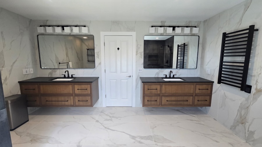 Is there anything about this bathroom that doesn't scream opulence, sophistication, and style?
Floor-to-ceiling large format tiles including a curbless shower - wet space sets the stage for this stunning bathroom
Custom floating his and hers vanities take the design to new heights
This bathroom is the epitome of luxury and functionality combined.
#bathroomluxury #bathroomdesignideas #bathroomrenovations #designbuildcontractor #fairfieldcountyct