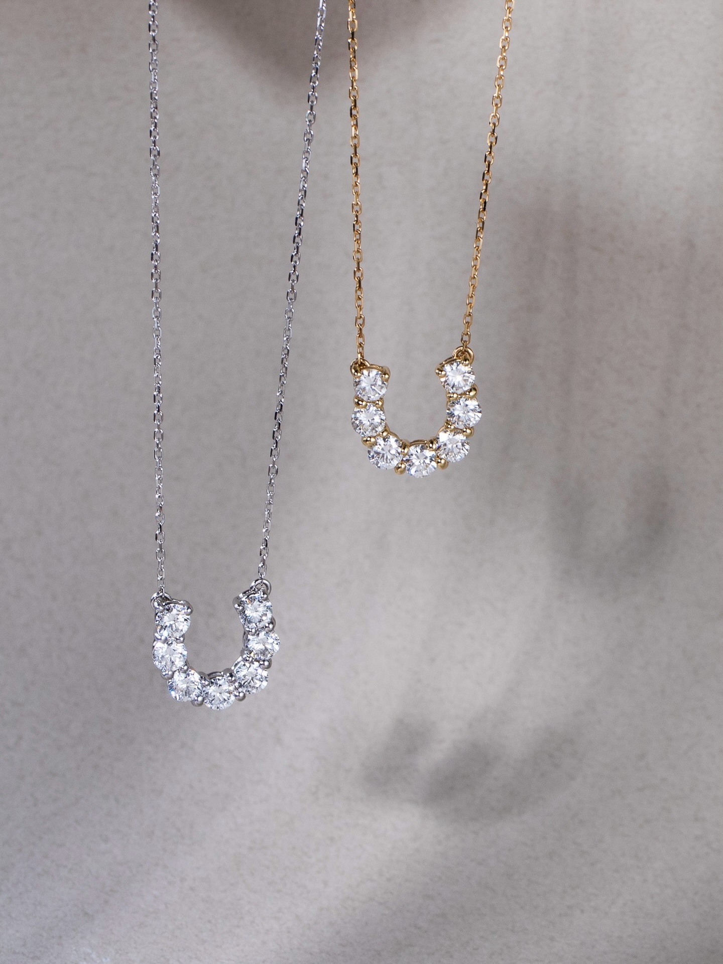 Formed with seven bold diamonds, the Horseshoe Diamond Necklace features a graceful horseshoe motif—long associated with luck and protection. Each stone is carefully set to create a balanced curve of light, offering a subtle yet distinctive presence on the neckline.
A symbol of transformation, freedom, and quiet strength — a poetic piece for everyday elegance or meaningful moments.
Discover the collection now at Fujimori Kajita Ann Siang Hill Boutique.