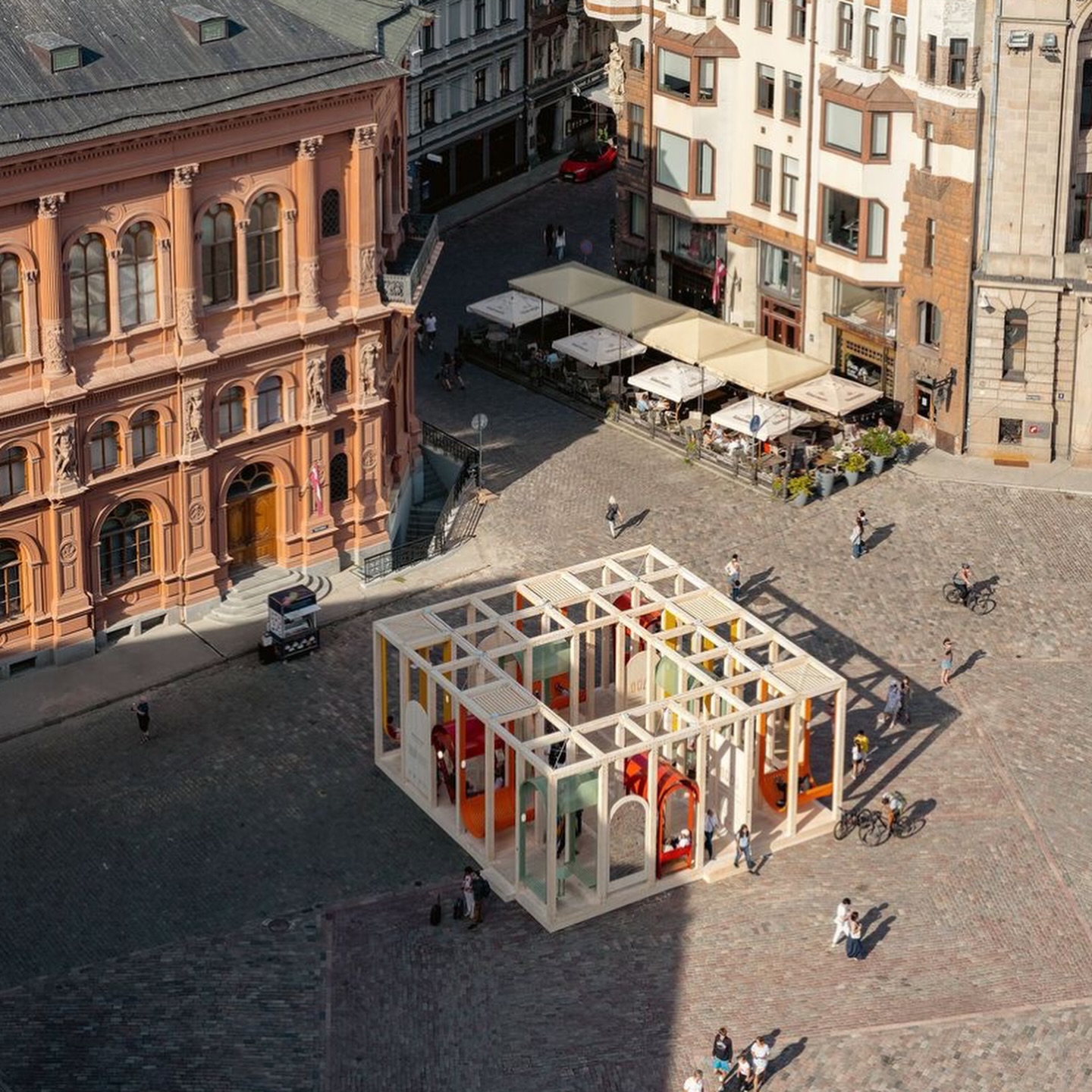 Isn’t this a gorgeous intervention.. space for playful moments in the most beautiful way!
Dome Next Door gently transforms a historic square in Riga into a place of curiosity, rest, and connection. A lightweight timber structure creates moments to swing, gather, pause… and see the city a little differently.
What we love most is how it invites people in without instruction.
No rules. No fixed program. Just subtle cues that encourage exploration and interaction.
Play is layered softly into the everyday;
a hammock here, a reflection there, a swing catching your eye.
It’s a reminder that small, temporary interventions can reshape how we experience public space; turning familiar places into shared, social, and playful environments.
What if more of our cities worked like this?
.
.
.
.
Project: Dome Next Door
Architects: Toms Kampars + Hori-Zonte + Jurgis Gecys + Antonella Amesberger
Lead Architects: Toms Kampars
Location: Riga, Latvia
Photography: Anna Barros
#CitiesForPlay #PlayfulCities #UrbanPlay #PublicSpace #ChildFriendlyCities