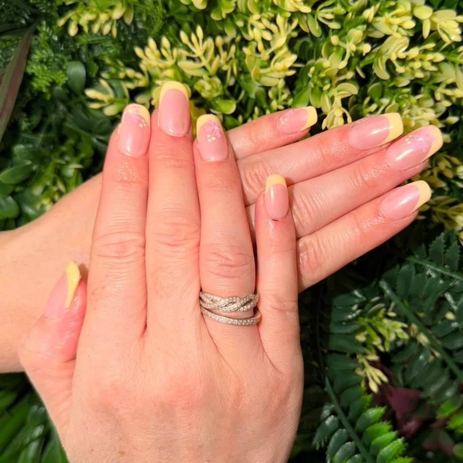 Blossoming into spring with these dreamy yellow French tip express acrylics 🌼✨
Created by our talented senior beautician Jemma, this set features soft pastel yellow tips paired with delicate hand-painted floral details for the ultimate fresh, feminine vibe. Think sunshine tones, creamy nudes, and tiny blooms bringing everything to life 🌿💛
Perfect for welcoming brighter days and blooming confidence 🌸
