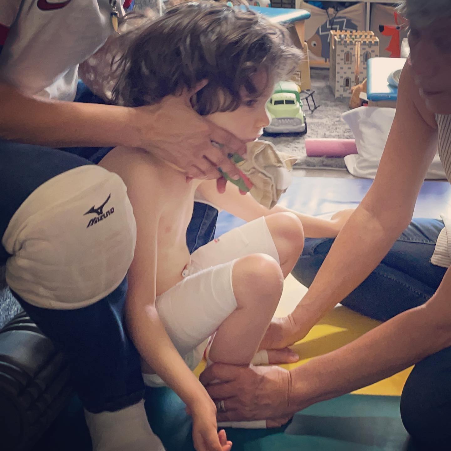 After lots of laying around in hospital beds, it’s time to get moving. Our first week back and the boys have been having intensive physical and occupational therapies. It’s been hard work, but I can see their heightened awareness, their minds and bodies are connecting. The brain is a muscle and it has to work to get stronger.
Yesterday, after Benny had PT, he was sitting in his chair with his Tobi - a computer he can control with his eyes, and use to communicate. He can choose a word and the Tobi will speak it out loud. As I sat working next to him, he says. “Eat. I, Eat” he was hungry, and let us know! As I went to prepare food for him, his therapist PT began talking to him, and Ben said “You. All Done” He was done with his session and didn’t want to talk to her! I wish I had the camera rolling to capture his immediate and appropriate conversation skills! He’s getting quicker with using the computer to speak! I’m so excited to be able to engage with him.
After dinner, I found Josh sitting in his chair bringing his hands to midline (therapist talk for bringing them together, a neurological milestone) and he was just smiling and feeling them! I know it seems so simple, but children with Canavan are typically so disconnected from their bodies. Josh was exploring his!
Before Their gene therapy, every day meant more brain damage, more degeneration, more loss. Now, we have hope. We have possibilities. Thank you everyone who helped us get here.
Continue exploring the world little ones…
#curecanavanfund #SaveBennyandJosh #genetherapy #neuroplasticity