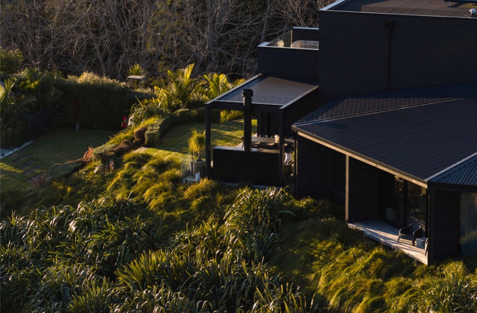 A roofline that responds as much to the landscape as it does to the home itself.
The hexagonal form of this single-level wing creates a series of considered volumes — each oriented to capture light, frame views, and connect seamlessly to the surrounding environment.
Finished in dark cladding, the home quietly recedes into the landscape, allowing the architecture to sit with restraint rather than compete.
#CalleyHomes #ArchitecturalDesign #NZHomes #DesignAndBuild #ModernArchitecture #Materiality #CoastalLiving
