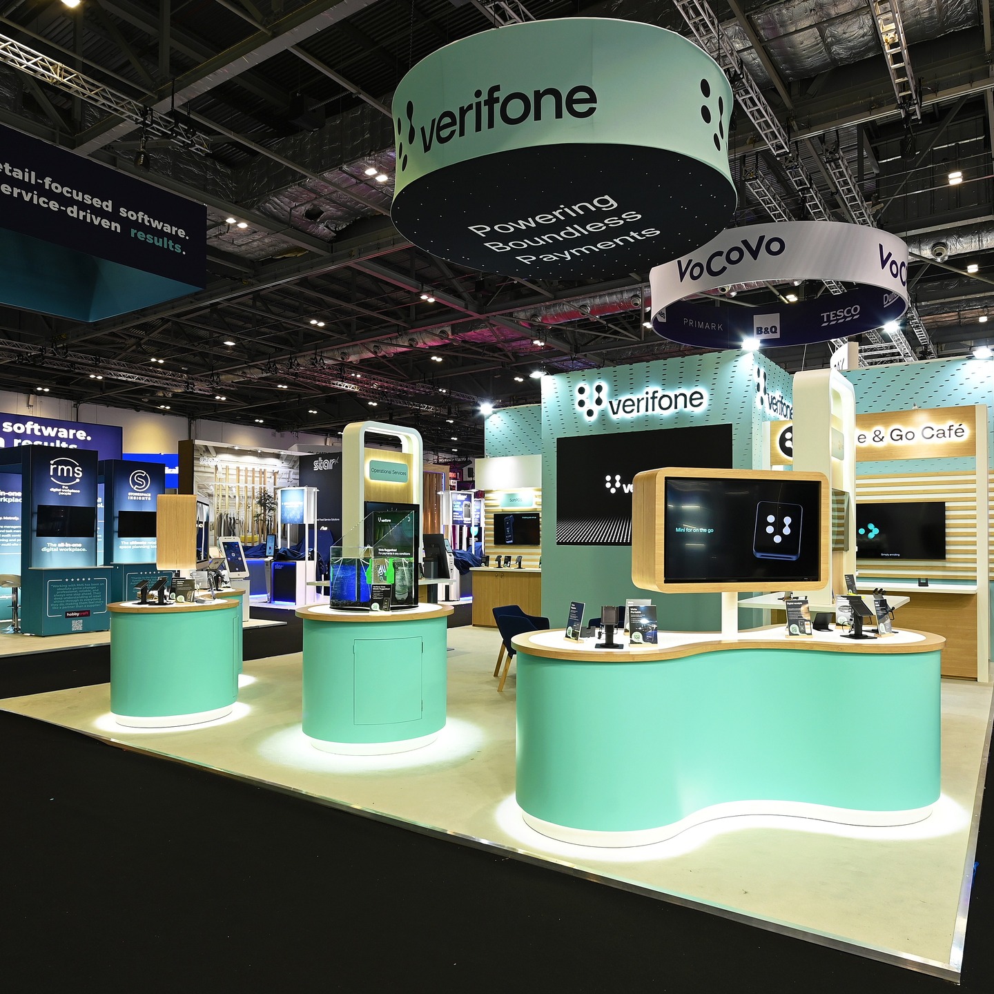 Next up: it's the unmistakable mint green brand colours of retail point-of-sale electronic payment machine and services provider Verifone. ๐ข
A brand for whom we regularly designed and built stands throughout the 2010s at shows like Apps World, Ecommerce Expo and Card & Payment Solutions, this is our second time delivering for them at @retail.technology.show after they returned to us last year. ๐ท๐ปโโ๏ธ
In exhibition stand design, it's the little details that effectively reinforce and communicate brand identity - in this case, the counters imitate the keypad buttons and infinity shape within the Verifone logo.
The curved faces also reflect a high-end ergonomic feel, with their angled positioning nicely framing the edges of the stand, creating a semi-private internal area for delegate discussion and networking. ๐ฃ๏ธ๐ซฑ๐ปโ๐ซฒ๐ป
#retailtechnologyshow #rts #event #exhibition #london #design