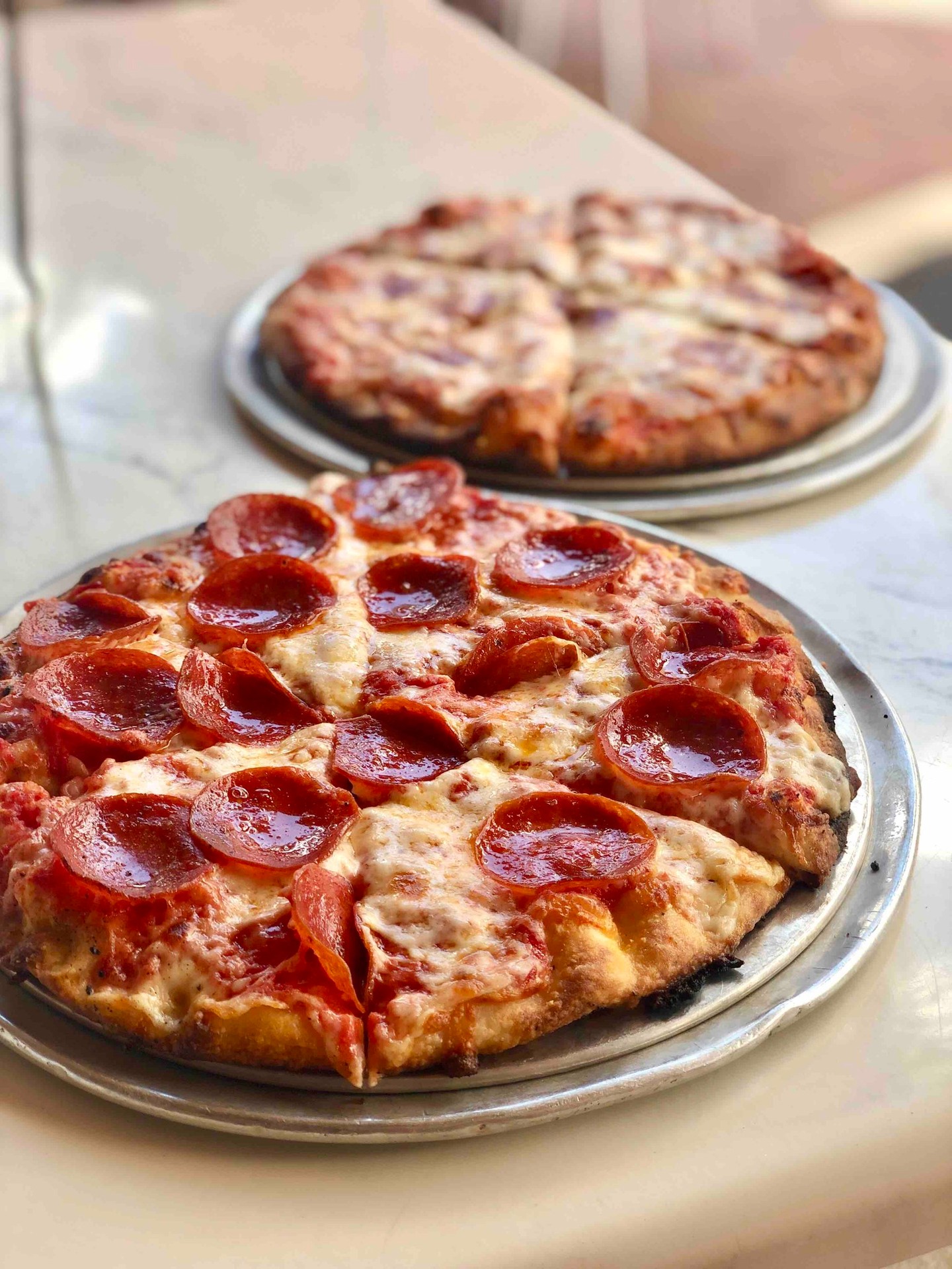 Team Pepperoni or Team Cheese?
Either way, it’s coal-fired perfection at Capone’s.