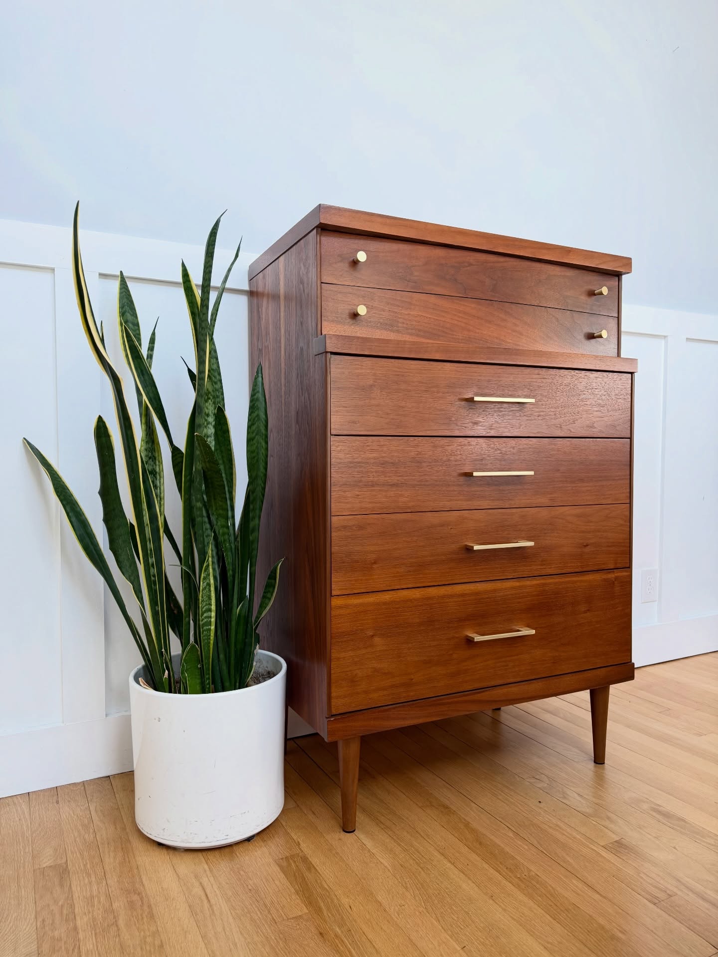 SOLD!! Beautiful walnut tallboy with 4 spacious dovetailed drawers. One deep curvy drawer on top and three on the bottom, one being double deep! Accented with nice brass hardware and peg legs.