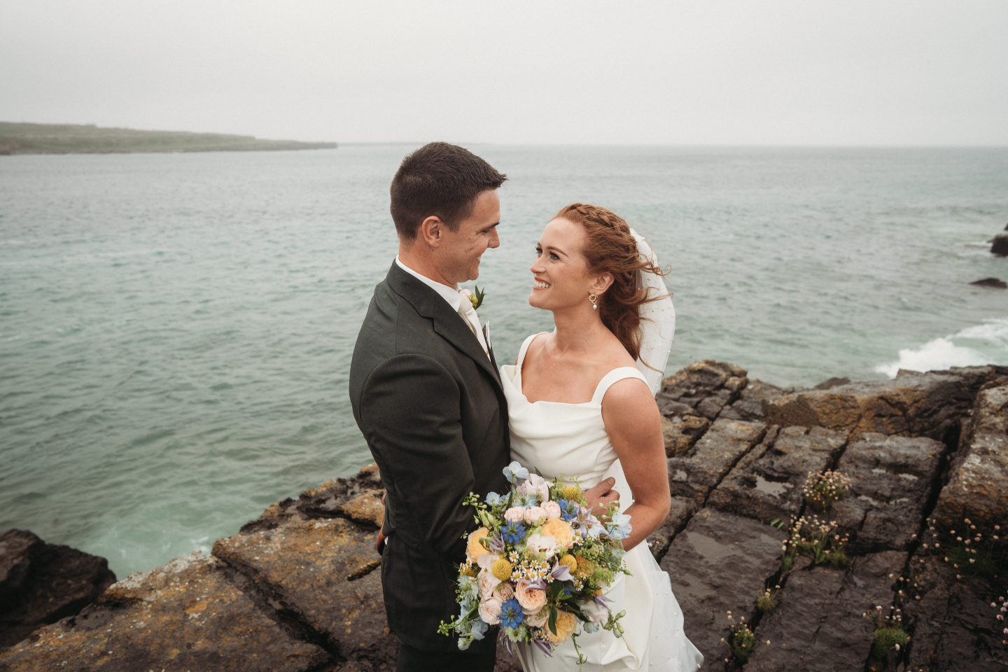Look at the beaitiful words from Maria and Shane who got married with us last year.
We had the greatest experience planning our wedding with The Aran Islands Hotel. Niall and his staff were always so accommodating. We planned our wedding from Australia and Niall had sisters and mothers and everyone in between to deal with on our behalf. Niall was on the other end of the phone whenever we needed him. The weekend went off without a hitch.
The entire staff was exceptional to all our guests. Many had flown from way across the world to be there. Everyone at the hotel went above and beyond.
The wedding day was wet and wonderful, adding to the wild west appeal. Throughout the entire day Niall was there hyping us when we needed to be hyped and calming us when the rain came and we were on a cliff edge. Honestly could not have asked for a better team to look after us on our wedding day. A dream destination.
