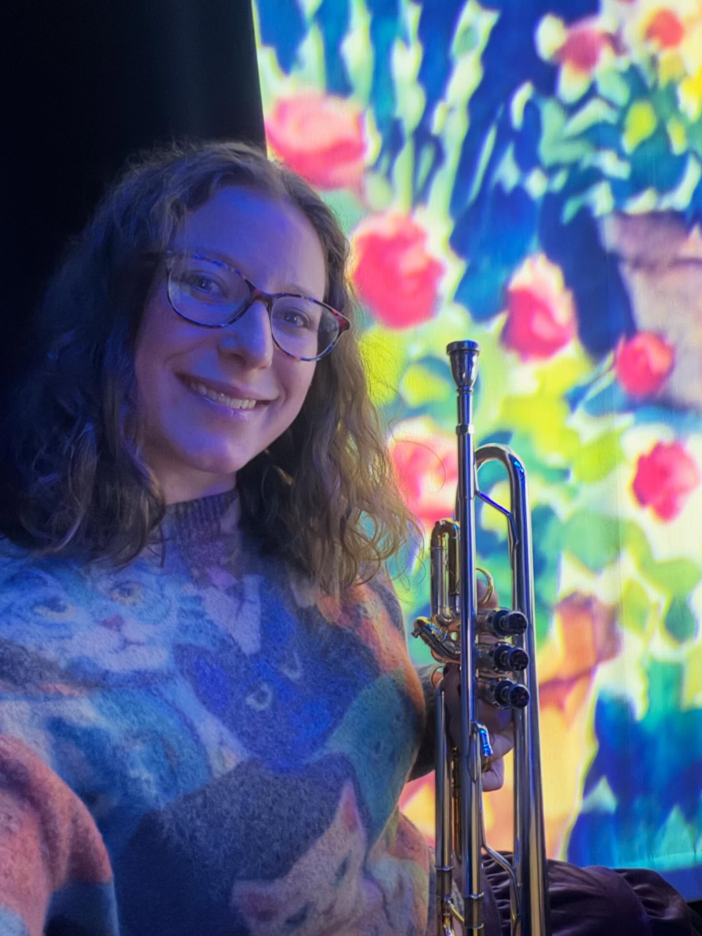 When the gig has a beautiful flower backdrop and you get to wear your cat sweater 😍 Best morning ever! 🎺#trumpetplayer #musicianlife #nycmusician #happymonday