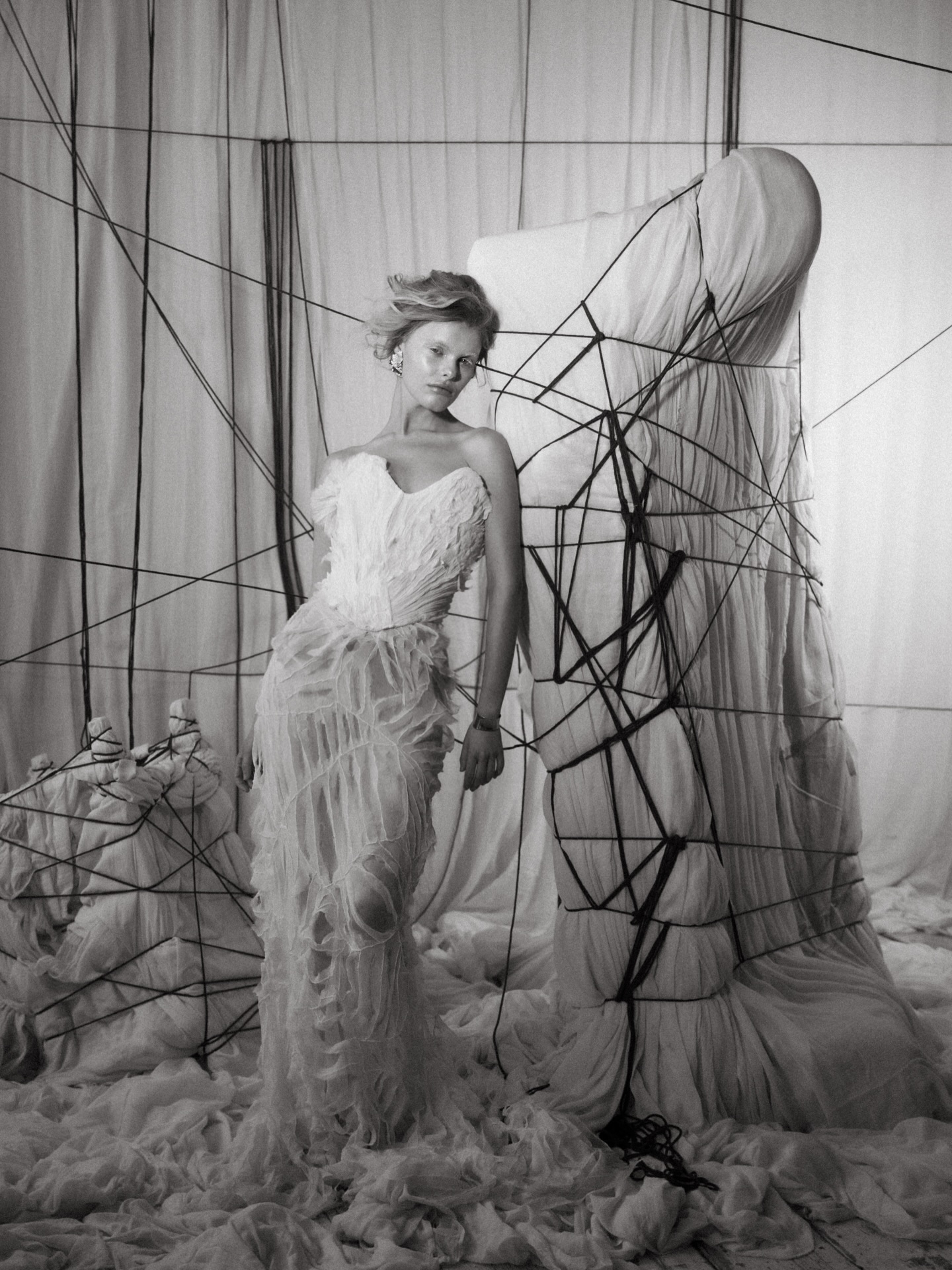 .
Dear Mariselle
I imagine you standing at the threshold of something once whole ~ not broken, but opened. As though life itself had traced its hands gently across you, leaving marks not of damage, but of becoming. You understood that perfection was never the goal; it was in the unraveling, the soft fraying of edges, that something more honest began to appear.
The Mariselle Dress was born from this quiet undoing. The corset is shaped from hand pleated georgette, each fold formed slowly, deliberately, holding structure while remaining fluid. It is adorned with soft florals and pearl seed beads. An embroidered silk skirt, intentionally slashed to reveal its delicate, frayed edges. Threads loosen, soften, and shift, creating movement not just in form, but in feeling. A glimpse into what lies beneath the surface, where beauty becomes more intricate.
Together, the elements create a balance of refinement and rawness, control and release.
This is a portrait of a woman who understands that to open is not to weaken, but to transform. That there is beauty in the edges. Her strength is not in holding everything together, but in allowing herself to unfold.
A creative piece, named MARISELLE, from the ‘Dear.’ Series, created to inspire brides to imagine their own bespoke art gown with me in London, where silk, texture, and emotion come together in something beautifully undone.
.
.
art direction/photography @ohh.ginger
dresses / full looks + bts @julita_ldn_bride
textile art @miasylviaa
glam @mayalewismakeup @mayalewisbridaldesigns
hair @daynavaughanteague.hair
muse @goldi___r
.
.
.