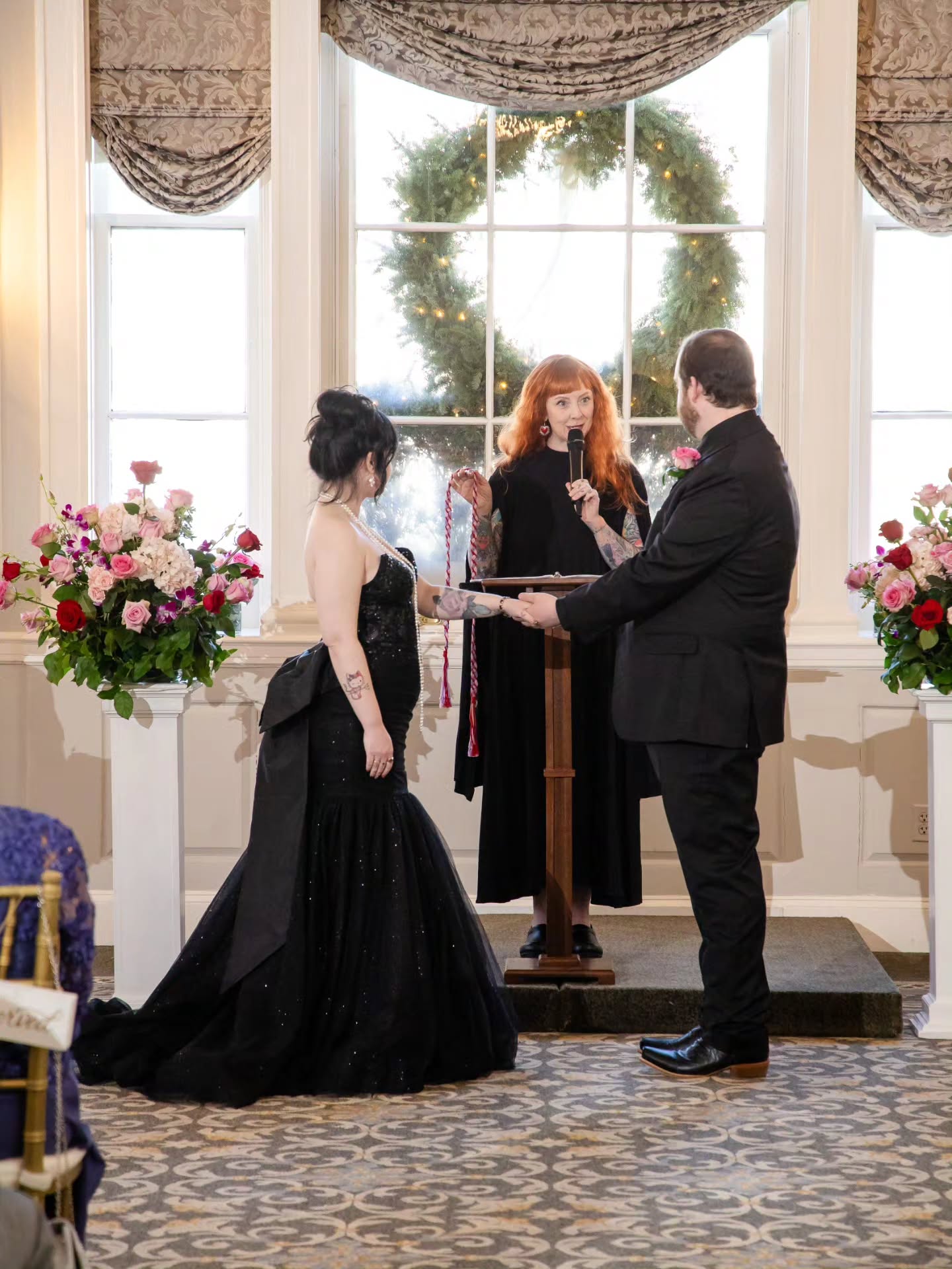 Fellow Salemites Matt & Meagan were married in a Valentine’s Day–themed celebration at the beautiful Hawthorne Hotel, surrounded by more than a hundred of their friends and family. Their story began nearly twelve years ago as friends, a bond that grew into true companionship. The ceremony I helped them craft was heartfelt and intentional, featuring a ring warming, a reading from Nathaniel Hawthorne, and a handfasting with a beautiful Valentine-inspired cord of pink, purple, and red. They exchanged rings, sealed their vows with a kiss, and stepped into the next chapter of their lives surrounded by the people who love them most. It’s always a treat when I get to help a local couple celebrate their unique and beautiful love story right here at home!
🖤💍🪢💝
📸 @benoitandmccarthy
💐 @flowers_bydarlene
🎤 @nuimageentertainment
📍 @hawthornehotel
💒 @hawthorneweddings