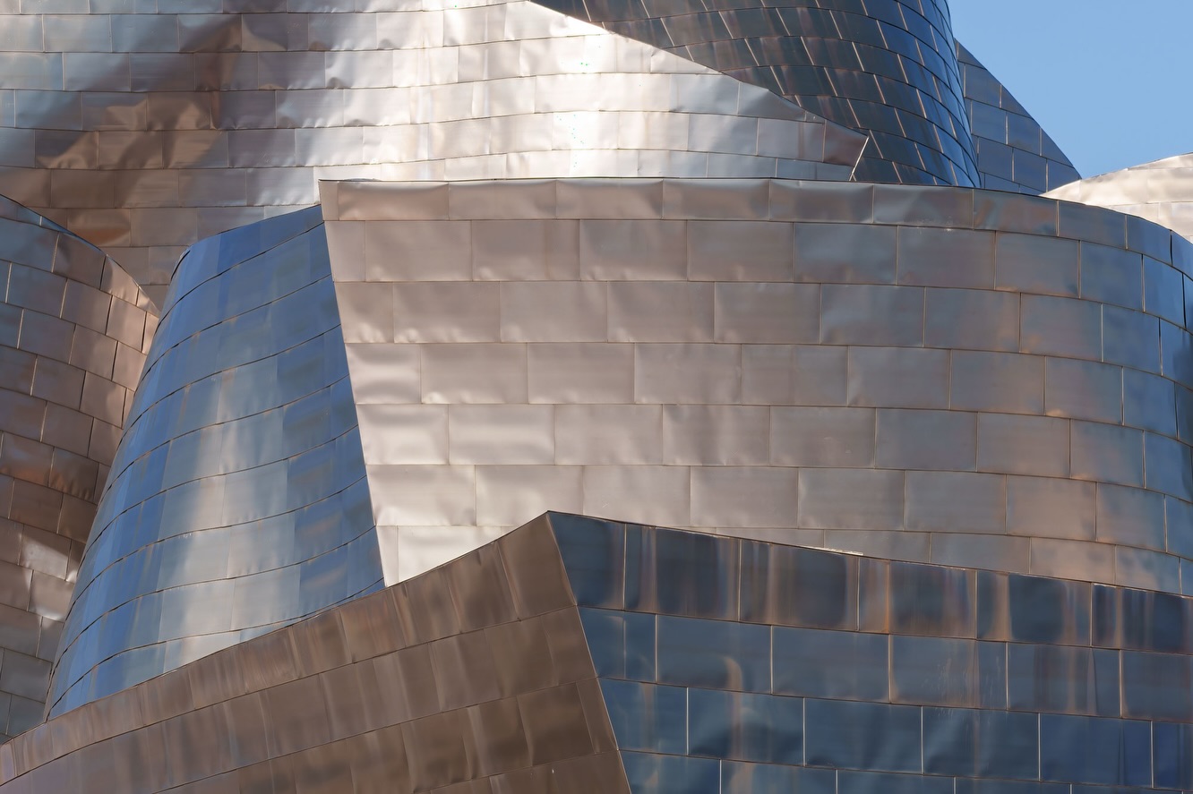 Where architecture becomes abstraction.
The Guggenheim in Bilbao is one of those places that almost refuses to be photographed as a whole. Instead, it reveals itself in fragments. Curves, lines, reflections - constantly shifting depending on where you stand and how the light touches the titanium surface.
During this session, I found myself drawn less to the iconic wide view and more to the details. The way warm and cool tones play across the metal. The tension between sharp edges and soft curves. The subtle imperfections in the panels that make the building feel alive rather than perfect.
It’s a place where you stop documenting and start interpreting.
For me, this series became less about architecture and more about rhythm, contrast, and light. Almost like photographing a landscape shaped by human hands.
Sometimes stepping closer reveals more than stepping back.
Shot on Sony A7 RV + Sigma 50mm f/1.2 DG Art & Sigma 70-200mm f/2.8 DG + Maven Filters ND3 Dark CPL + framed on Gitzo Systematic Tripod.