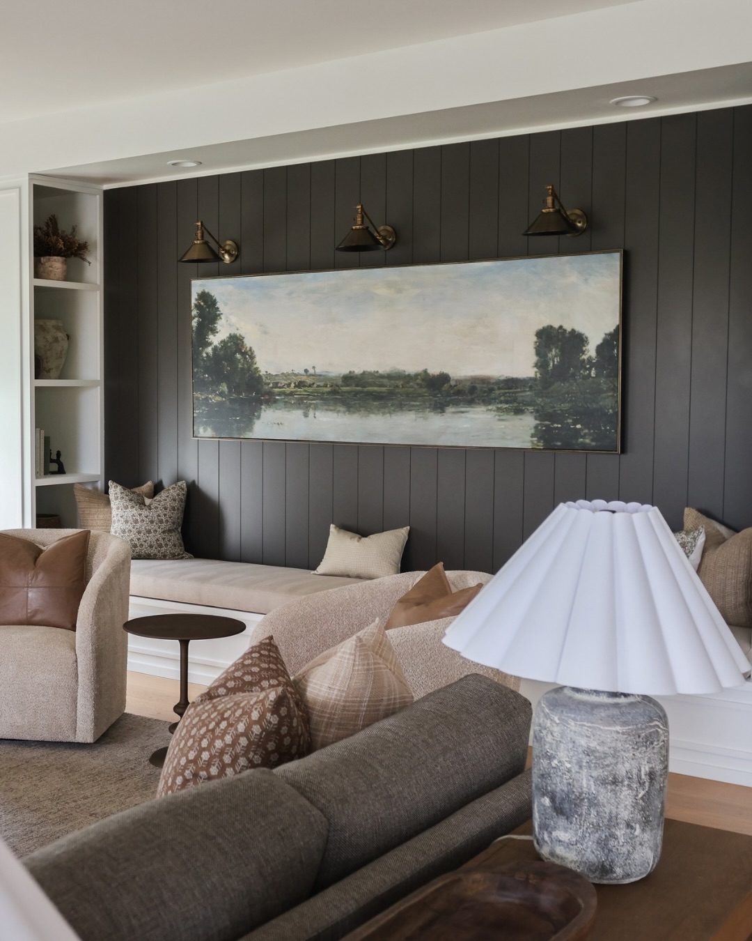 We can’t wait to show you more of this home 🤍
It’s cozy in all the right ways… layered, full of personality, but still feels calm, timeless, and elevated.
This little reading nook might be one of our favorite spots! Moody charcoal walls, warm brass, and just enough statement for timeless character!
⬇️ Comment DESIGN if you want help creating a home that feels like this