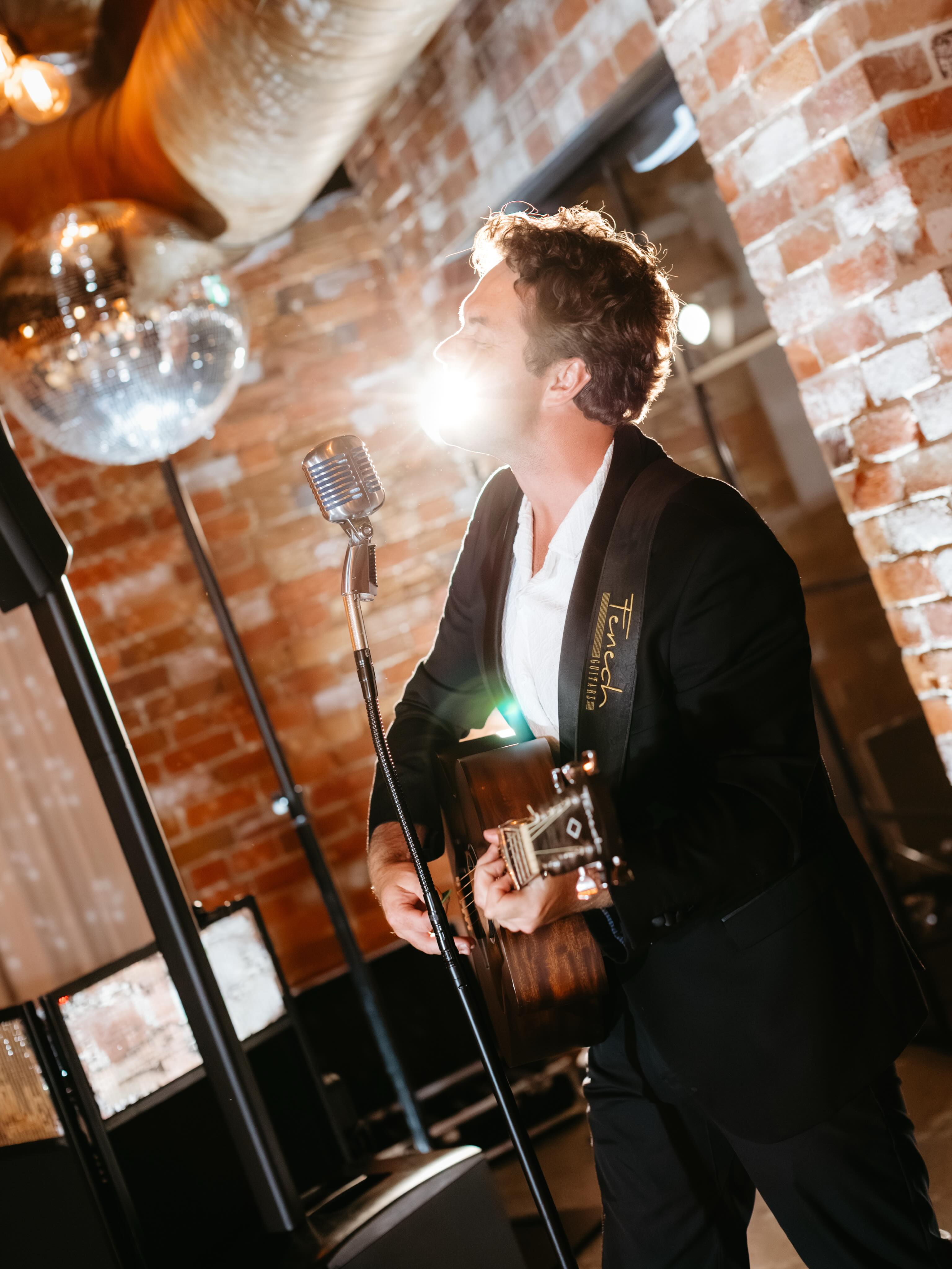 Just a man with his shiny Elvis mic, disco ball & @fenechguitars. @mirandastokkel at @coombeyarravalley for Cas & Sam.