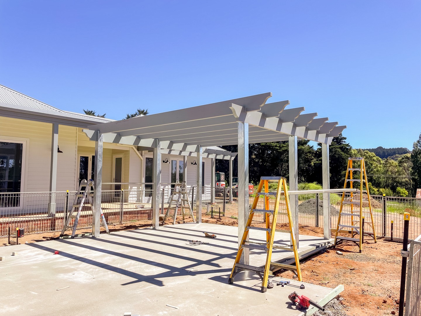 Back at Hesket for the exterior works, with this pergola structure now up over the concrete alfresco slab. The rafter profiles and galvanised steel posts tie back to the homestead character of the main build.
Looking forward to revealing the finished landscaping soon!
#buildtrendhomes #macedonrangesbuilder #hesket #pergola #custombuilder