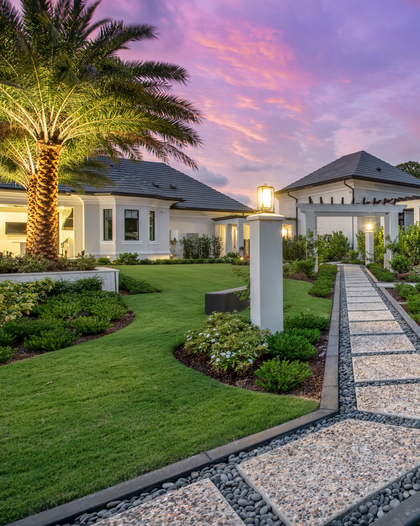 Twilight settles in, and the garden begins to glow. Framed by clean architectural lines, sculpted lawns, and a tabby stepping path set in river stone, this private residence was designed as an arrival experience that feels calm, elevated, and quietly unforgettable. Every detail leads you forward with intention.
In Naples luxury landscape design, the most powerful moments are often the most understated.
#NaplesFL #LuxuryLandscapeDesign #LandscapeArchitecture #OutdoorLiving #FloridaLiving