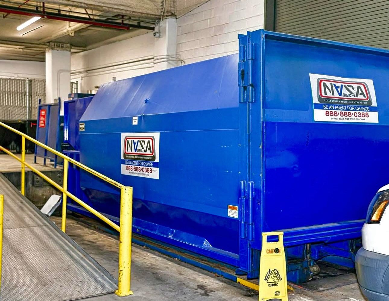 Ever wonder how large buildings, shopping centers, or hotels handle all their trash? This is a commercial waste compactor. Instead of using multiple dumpsters that fill up quickly, a compactor compresses all the waste into one sealed container.
This not only saves space but also reduces the number of pickups needed, which keeps loading docks clear and operations running smoothly. It’s a cleaner, more efficient solution for properties that generate high volumes of waste every day.