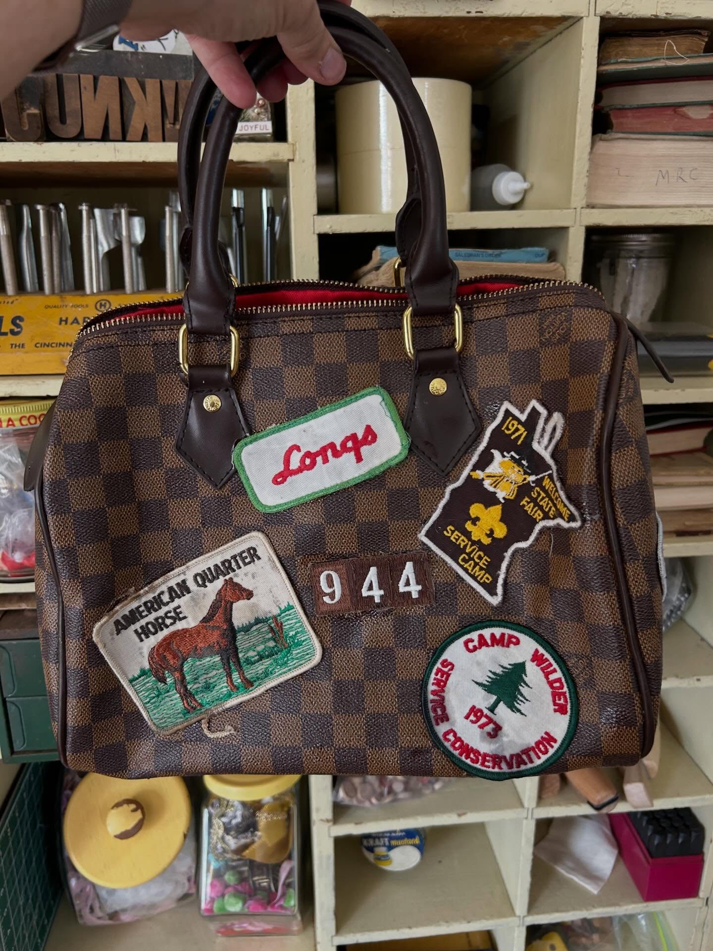 I’ve seen people adding patches to purses, so I gave it a shot! Mine's not designer, which made it way less stressful. Here are my tips:
👉Do one side at a time, and let it dry. Trust me.
👉Use tape to map out your design.
👉5-minute epoxy glue is a game-changer – apply with a popsicle stick.
👉Let it dry for 24 hrs and enjoy! lol