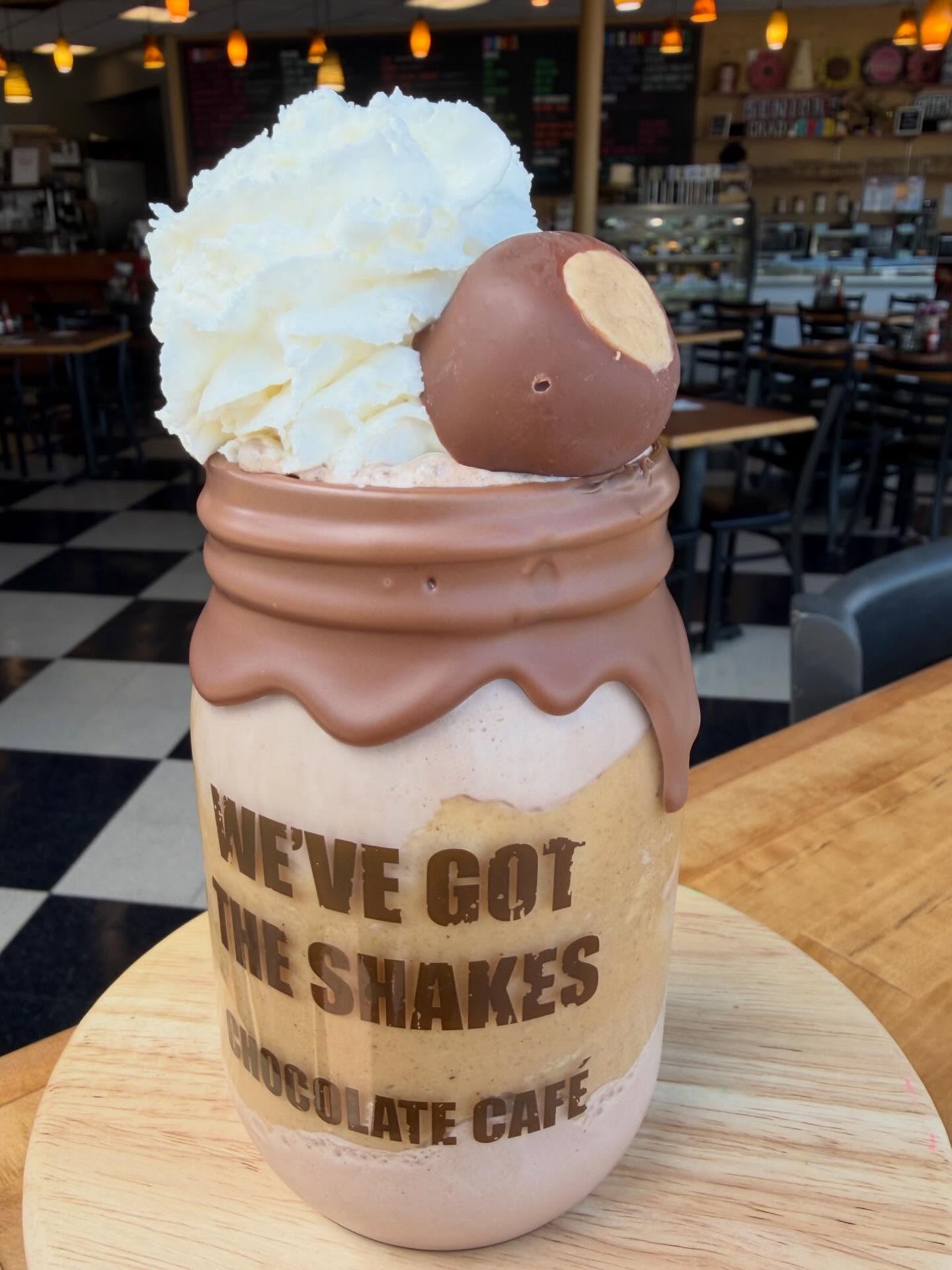 Holy Buckeye!! This peanut butter milkshake topped with a hand-rolled Buckeye is a Game Changer. #milkshake #buckeye #springfever #chocolatecafe #localbusiness