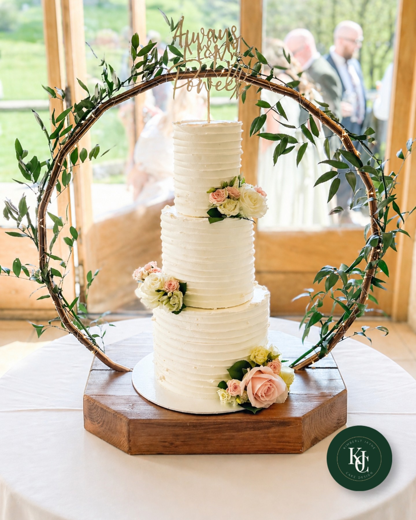 Rustic textures, soft florals and a setup that frames the cake perfectly 🤍
This three-tier buttercream wedding cake was designed for a wedding at Kingscote Barn in Tetbury, finished with horizontal texture, blush florals and a statement hoop stand wrapped in fresh greenery.
Fresh florals supplied by @scentiments_tetbury, tying everything beautifully into the overall styling.
Set against the stone walls and countryside views, it’s the kind of design that works with the venue, not against it.
If you’re planning a Kingscote Barn wedding and want a cake that fits the space seamlessly, I’d love to help.
🍰 Wedding cakes
https://www.kimberlyjaynecakedesign.co.uk/portfolio
📩 Enquiries open for 2026 & 2027
#kingscotebarnwedding #tetburywedding #cotswoldswedding #weddingcakeuk #luxuryweddingcake