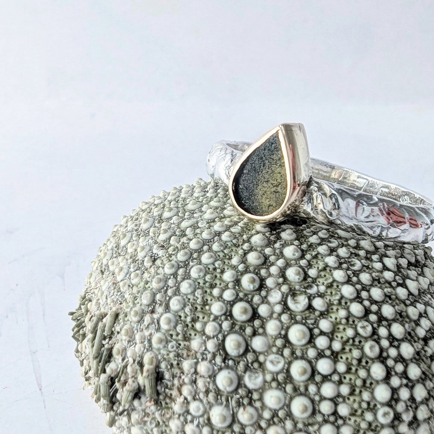 What a classic! The beautiful Ariel ring is a quiet whisper of appreciation for the sea. A delicately hand cut tear drop piece of sea glass, the original "Mermaid's tear" set in Gold and on a textured ring band.
Each one is individually created and is for anyone who longs to keep a piece of the ocean with them, most certainly for any mermaid soul, a sea glass ring is an absolute must!!!
#seaglassjewellery #seaglassring #alternativeengagementring #seaglassengagementring #ethicallymadejewellery