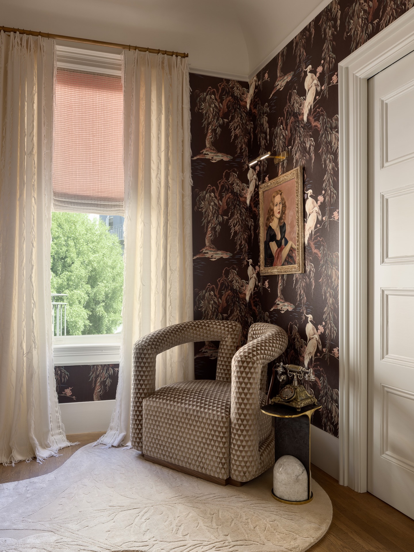 A quiet corner, layered with story.
The Gemini Chair by Mous, upholstered in sumptuous Dedar, offers a sculptural moment of rest - set atop a custom meandering rug, inspired by the movement of the wallcovering and brought to life in collaboration with Casa Cita Rugs. As the light shifts, the rug comes alive throughout the day, softly glistening in the sun.
Framing the space, the window treatments by Sandra Jordan Prima Alpaca - meticulously crafted by Dawson Custom Workroom - fall like soft plumes of feathers, introducing a sense of calm and quiet rhythm.
An antique telephone - perched atop a Holly Hunt table in bronze and marble - invites a moment of connection, where visitors can listen to a greeting and leave a message of their own - while the portrait of my Aunt Dodie watches over the room, adding a deeply personal layer to the space.
Birds of a Feather is, at its heart, a reflection on connection—past and present, near and far.
Design: @sonomainteriors
Build: @dotto_company
Photography: @tim.d.coy.photography
Styling: @lucybamman
#BirdsOfAFeather #SFDecoratorShowcase #SonomaInteriors #InteriorDesign #DesignDetails