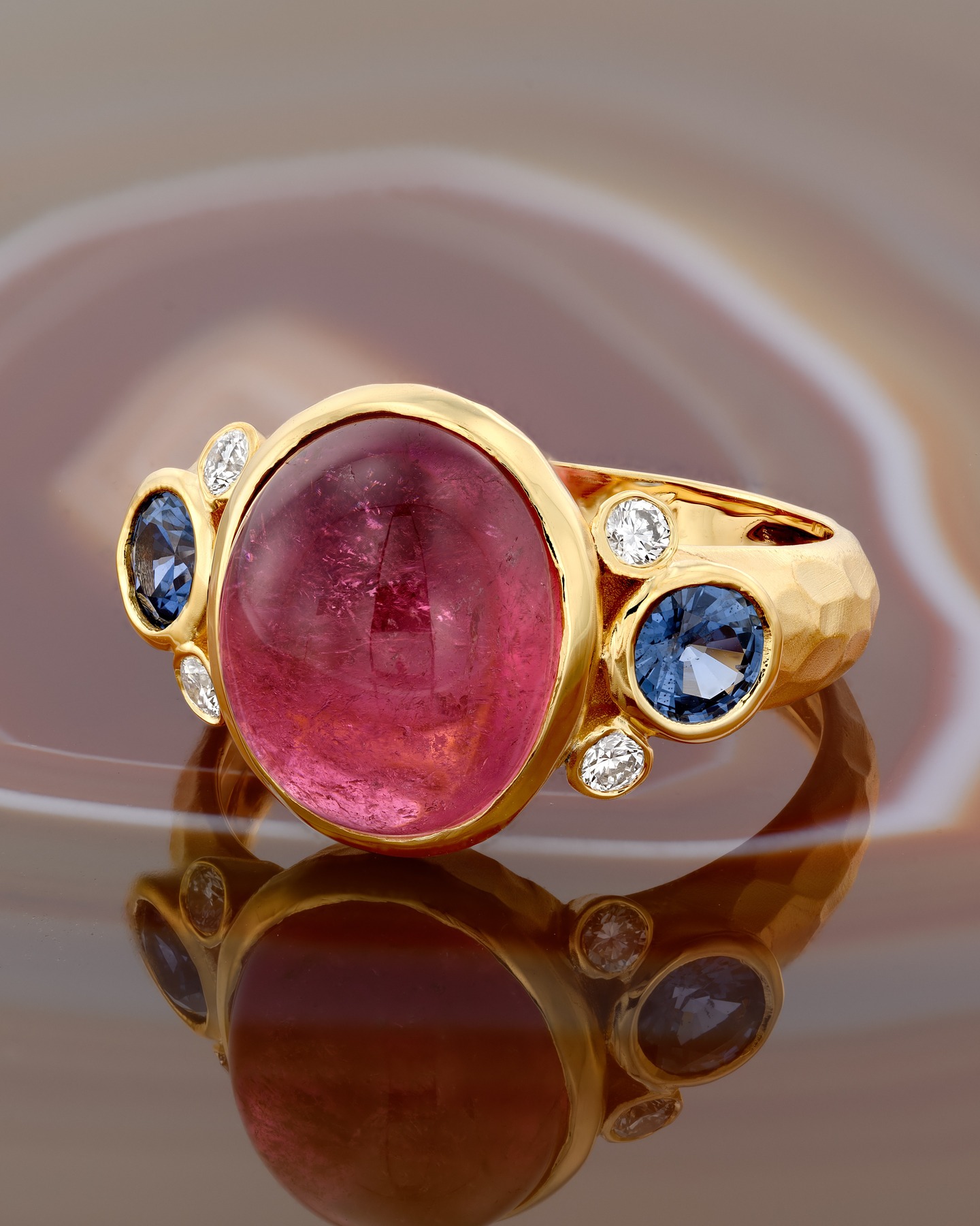 A bold composition in color and craftsmanship. handcrafted gold ring centered with a luminous pink tourmaline, framed by deep blue sapphires and brilliant white diamonds. Sculptural, vibrant, and entirely made by hand, this piece is a celebration of fine detail and timeless individuality.
#handmadejewelry #BlueSapphires #DiamondRing #GoldRing #finejewelry #jewelrydesign #LuxuryJewelry #StatementRing #craftsmanship