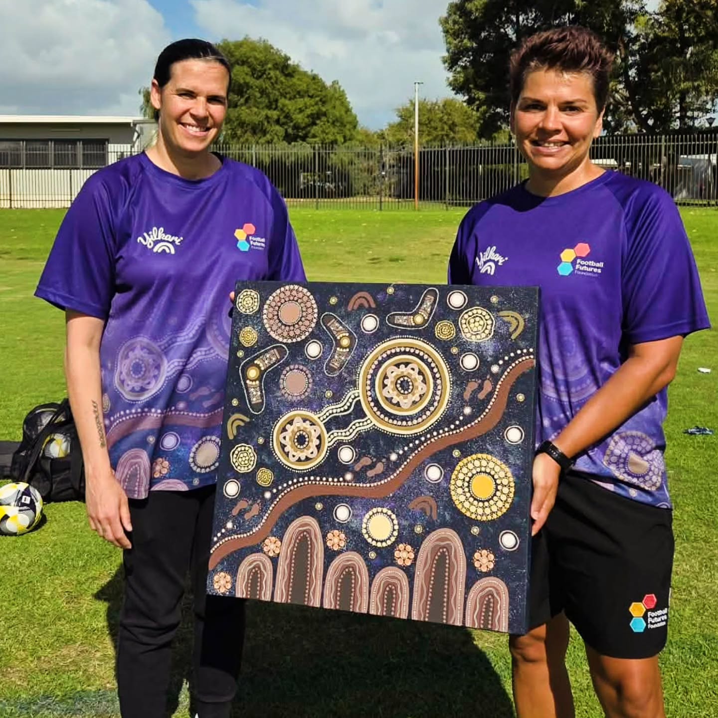 Yilkari - creating spaces where girls can dream bigger 💜⚽️
A surreal moment for Mel, creating artwork that honours Lydia’s journey while standing beside a true role model for so many young girls.
Culture, leadership, and inspiration for the next generation ✨