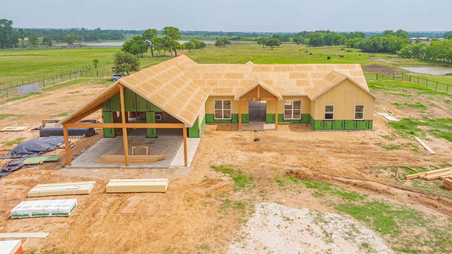 Front of home with beveled timber ridge beams at gables. Thanks @ Bill Nikoli for having us on your job.