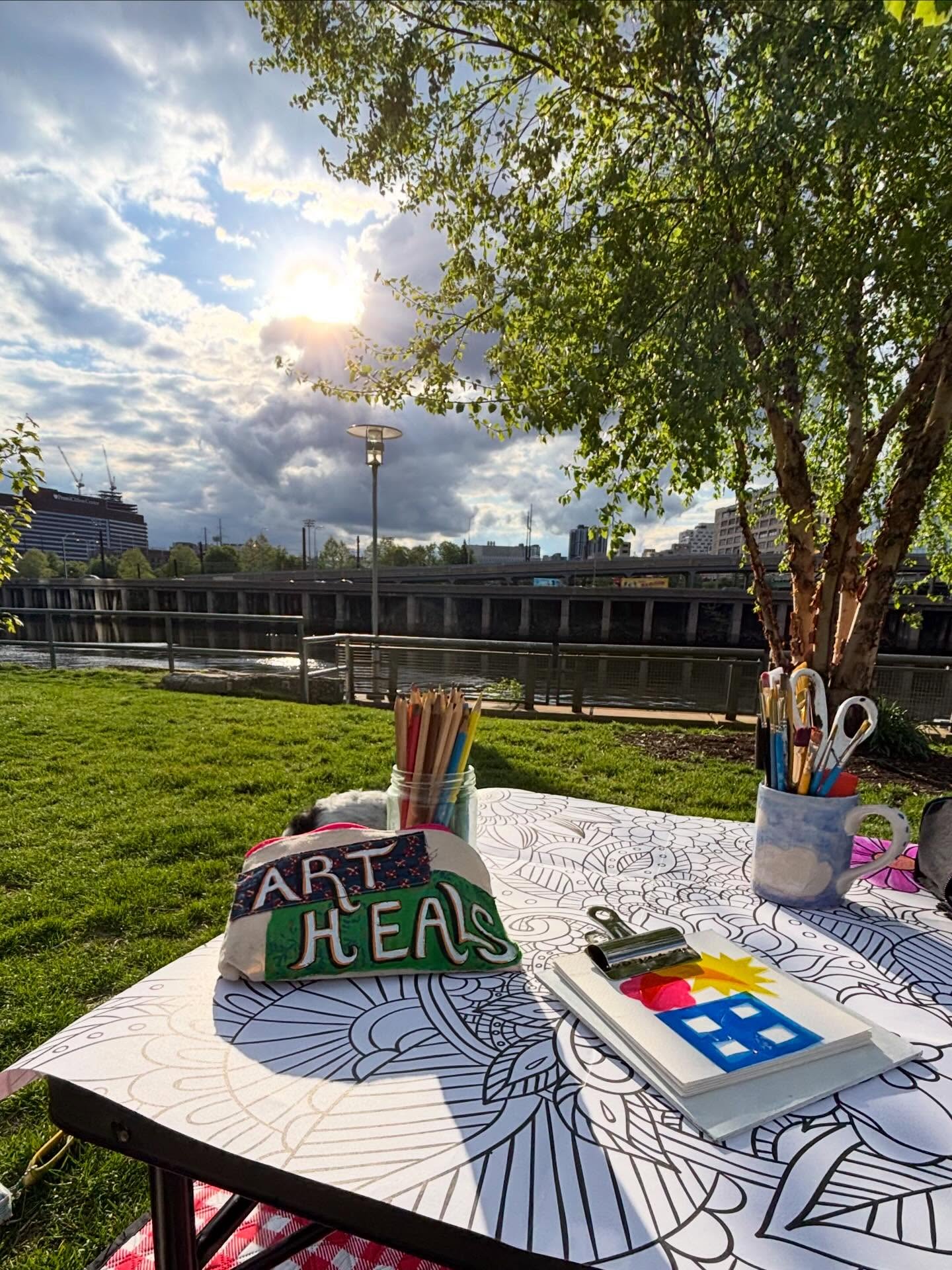 4.30.26 - ARTSIDE w/Astrid Recap
Slide 1: The sun peeking out in between clouds. Supplies scattered on the canvas/table with a pouch that reads “Art Heals”.
Slide 2: A few curious folks (and Josh) stop by and join in the canvas. Unstructured play and taking a moment to slow down.
Slide 3: Lewis joined us spontaneously during his walk. After chatting and adding his own intricate flower to the canvas, he promised “I’ll be back!” - to see this project continue.
Slide 4: Our beautiful canvas after session #1. Excited to see this piece grow and see what other fun things we can create at ARTSIDE 🖼️